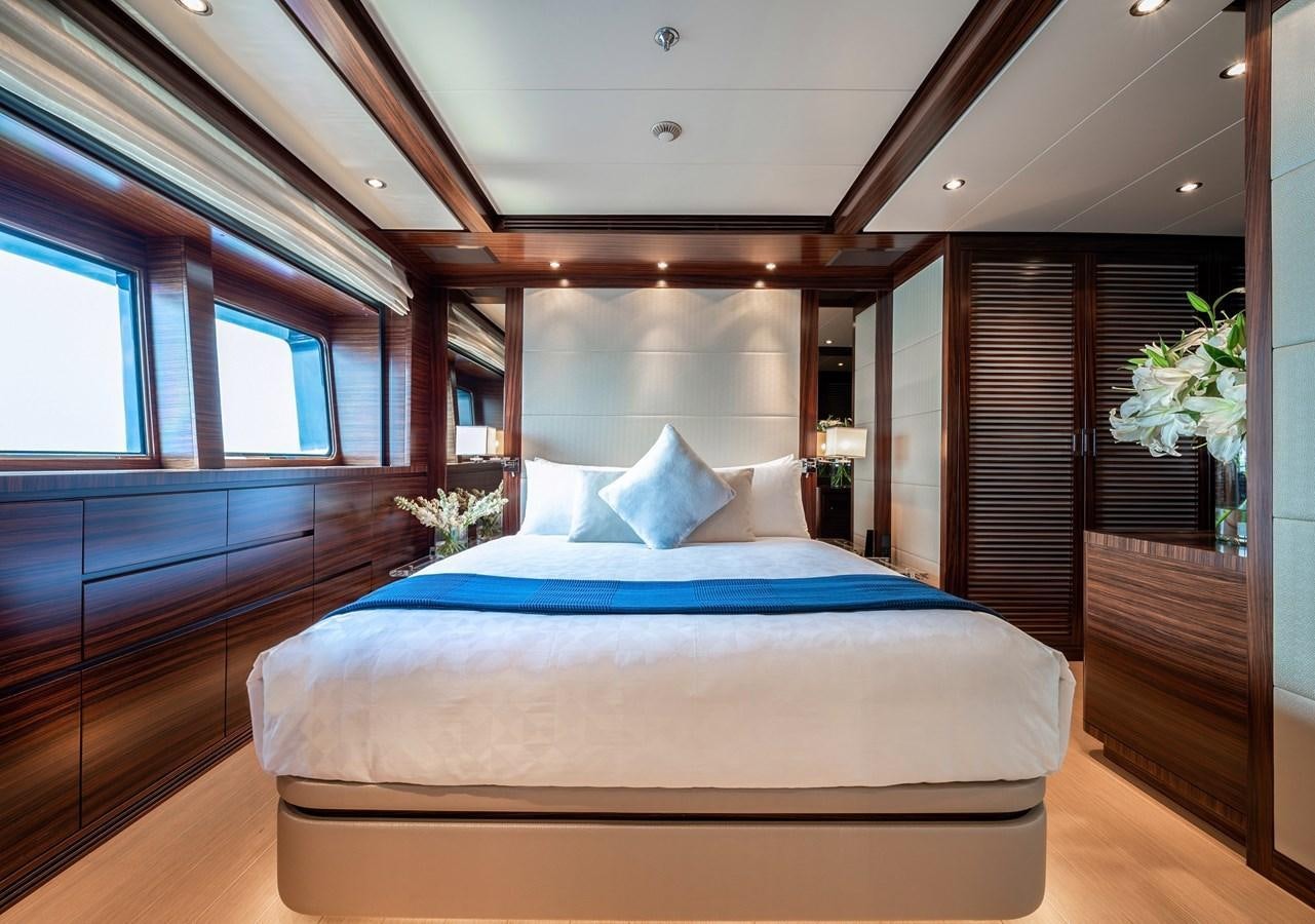 a bed in a room aboard ATLAS Yacht for Sale