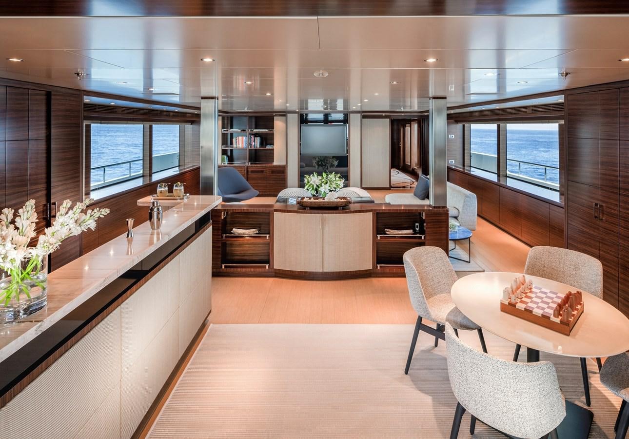 a modern kitchen with a large island aboard ATLAS Yacht for Sale