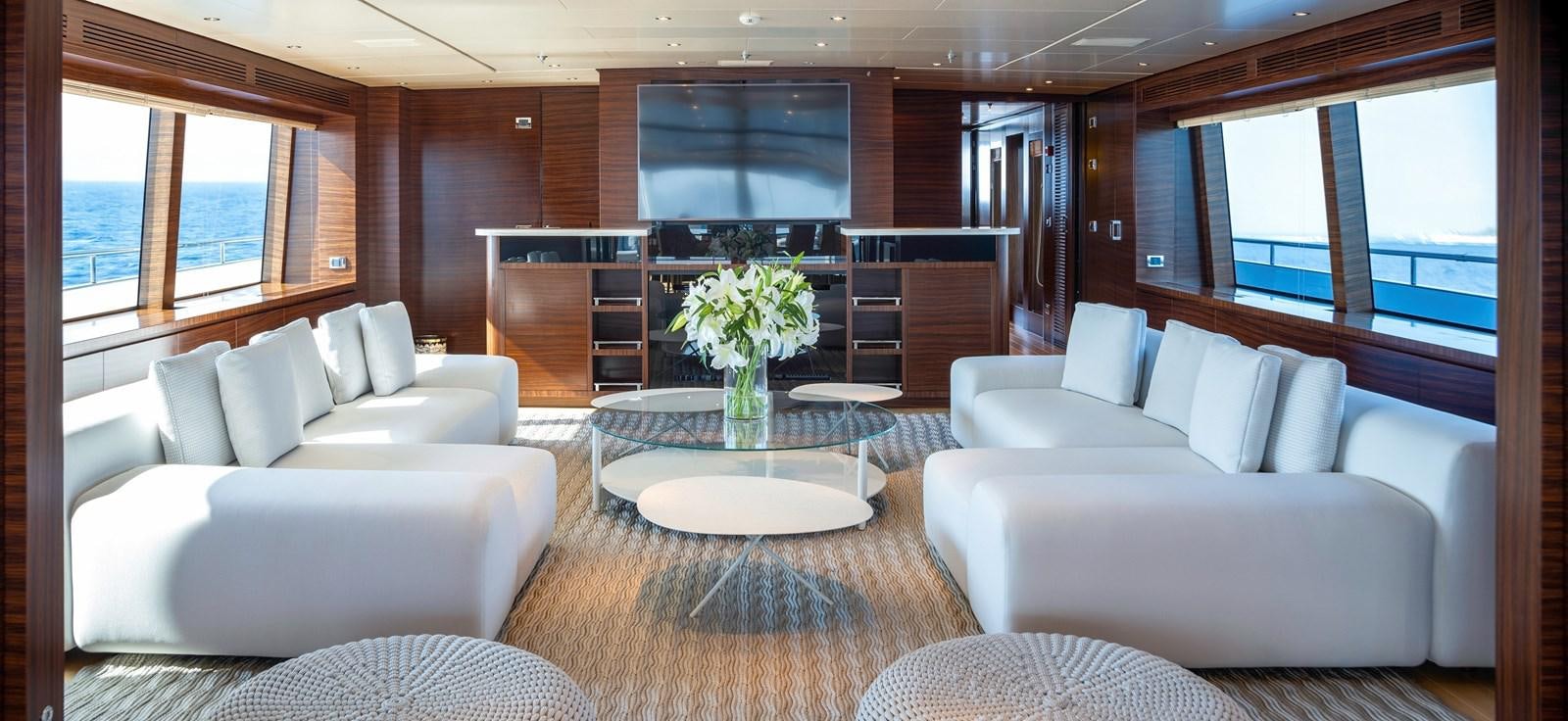 a living room with a large window aboard ATLAS Yacht for Sale