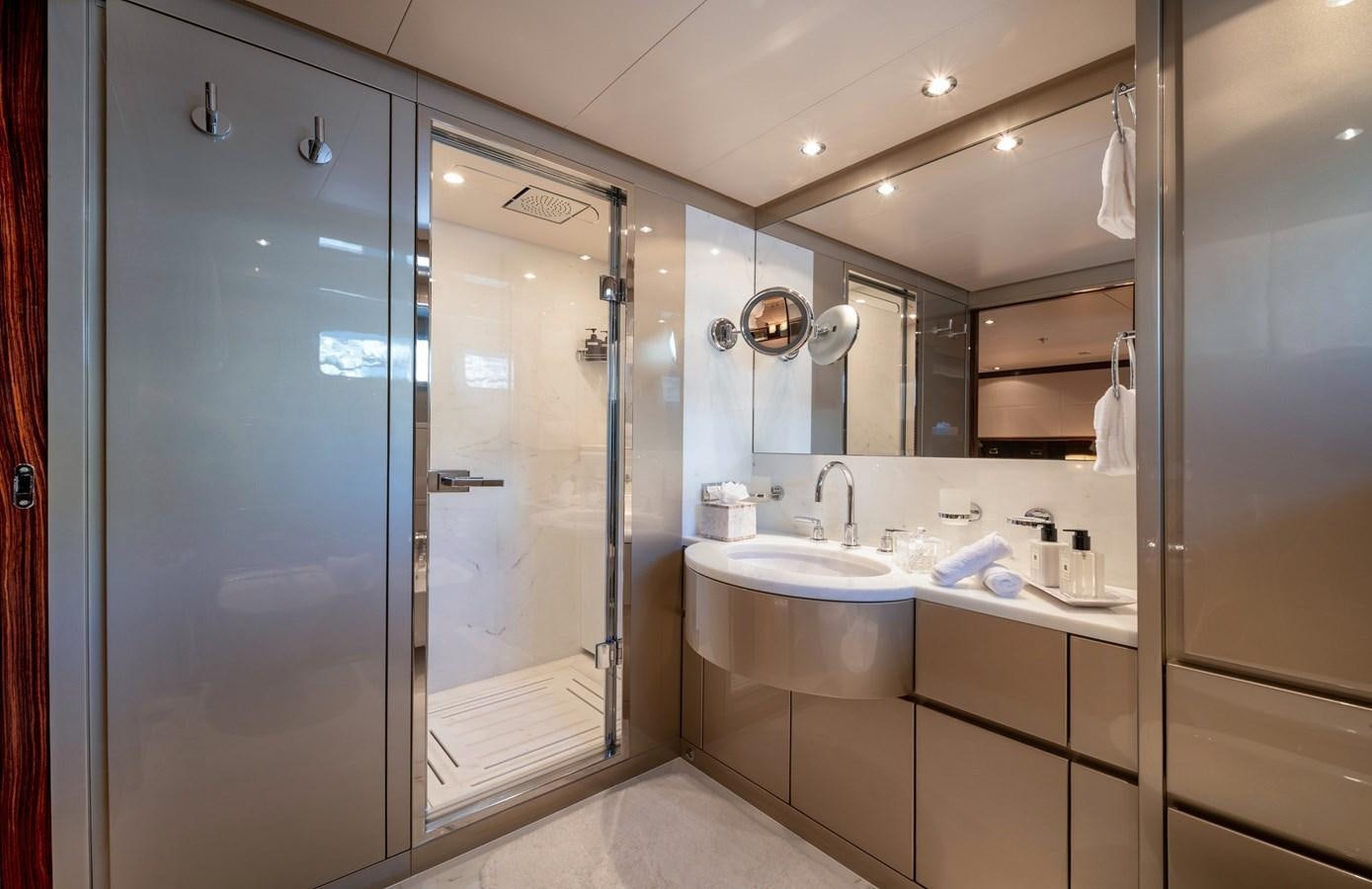 a bathroom with a glass shower aboard ATLAS Yacht for Sale
