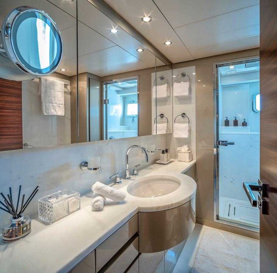 a bathroom with a large mirror aboard ATLAS Yacht for Sale