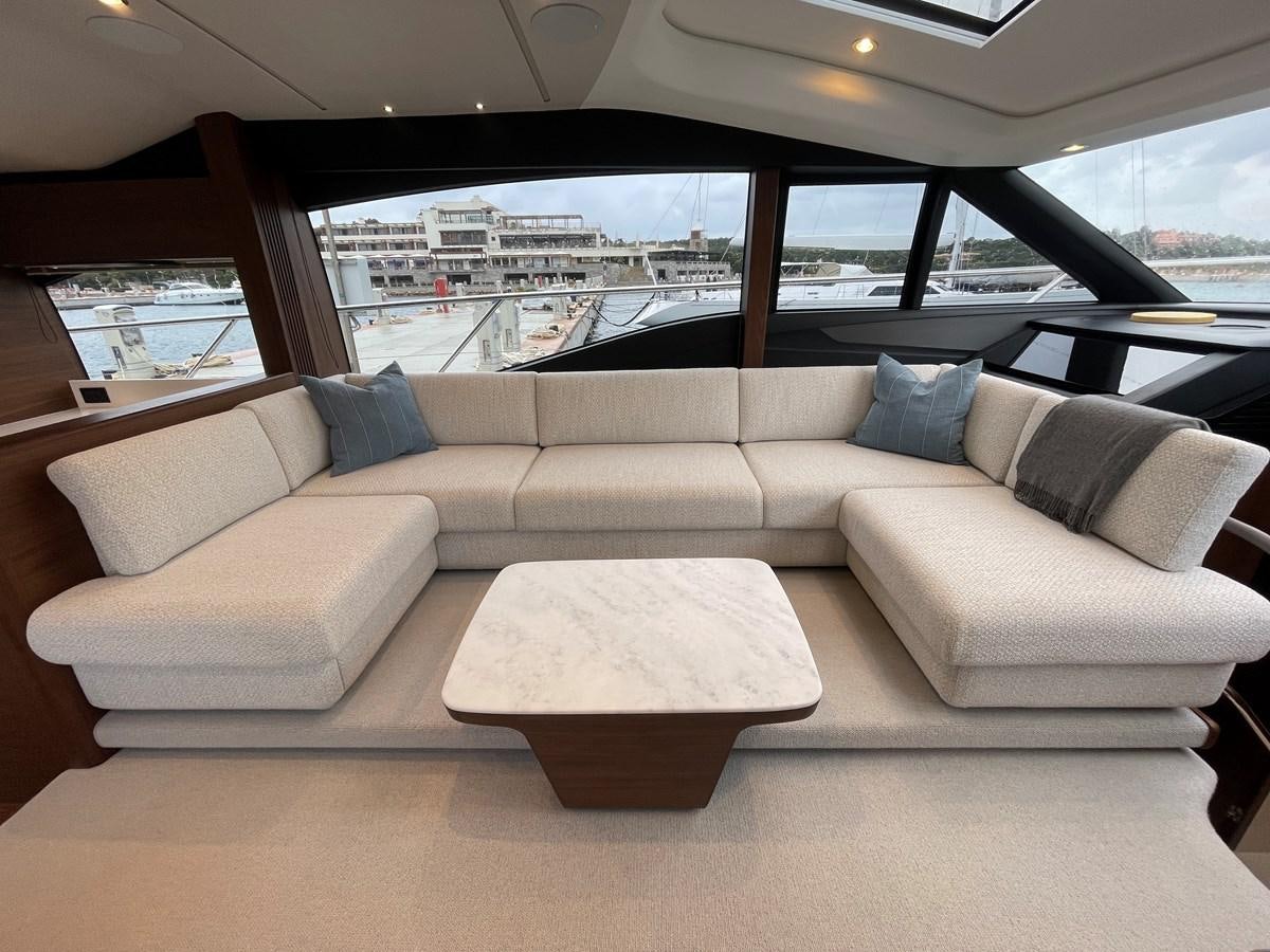 a couch in a car aboard LESTO Yacht for Sale