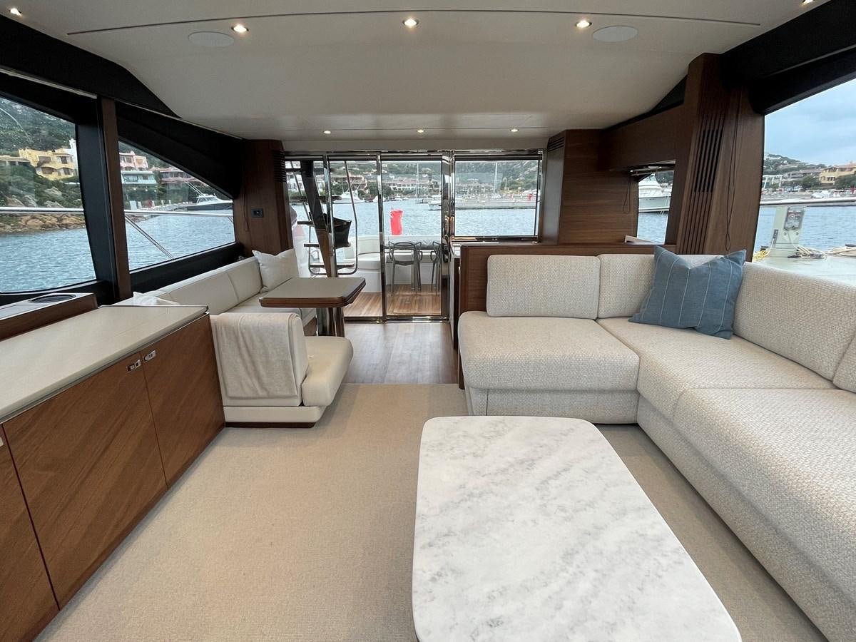 a room with couches and a table aboard LESTO Yacht for Sale