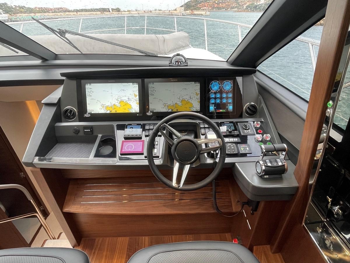 a control panel with a screen and buttons aboard LESTO Yacht for Sale