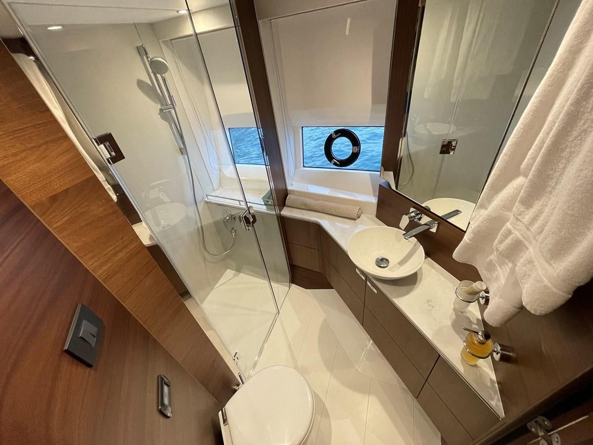 a bathroom with a large mirror aboard LESTO Yacht for Sale