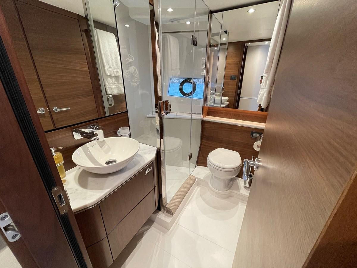 a bathroom with a large mirror aboard LESTO Yacht for Sale