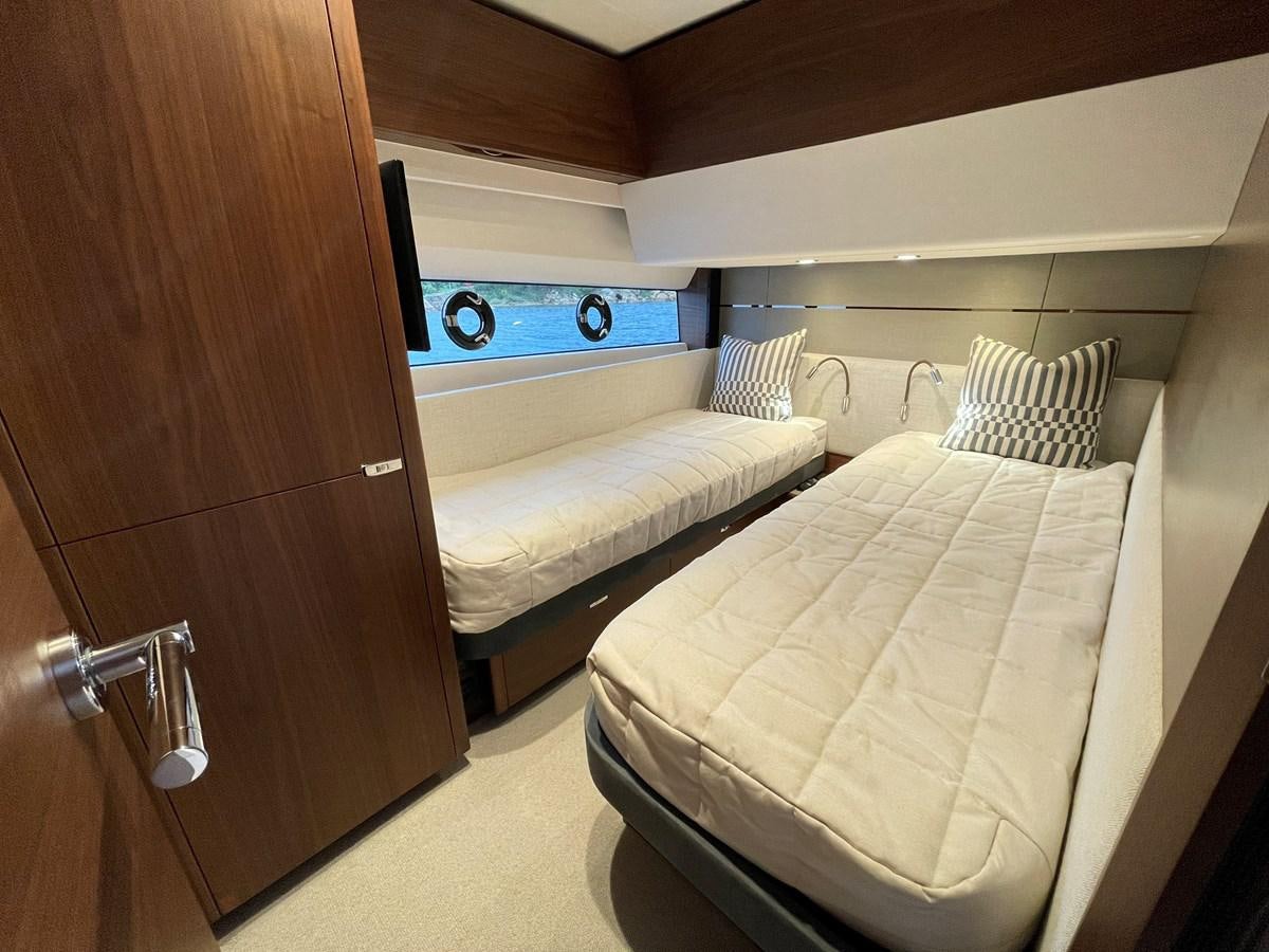 a room with a bed and a closet aboard LESTO Yacht for Sale
