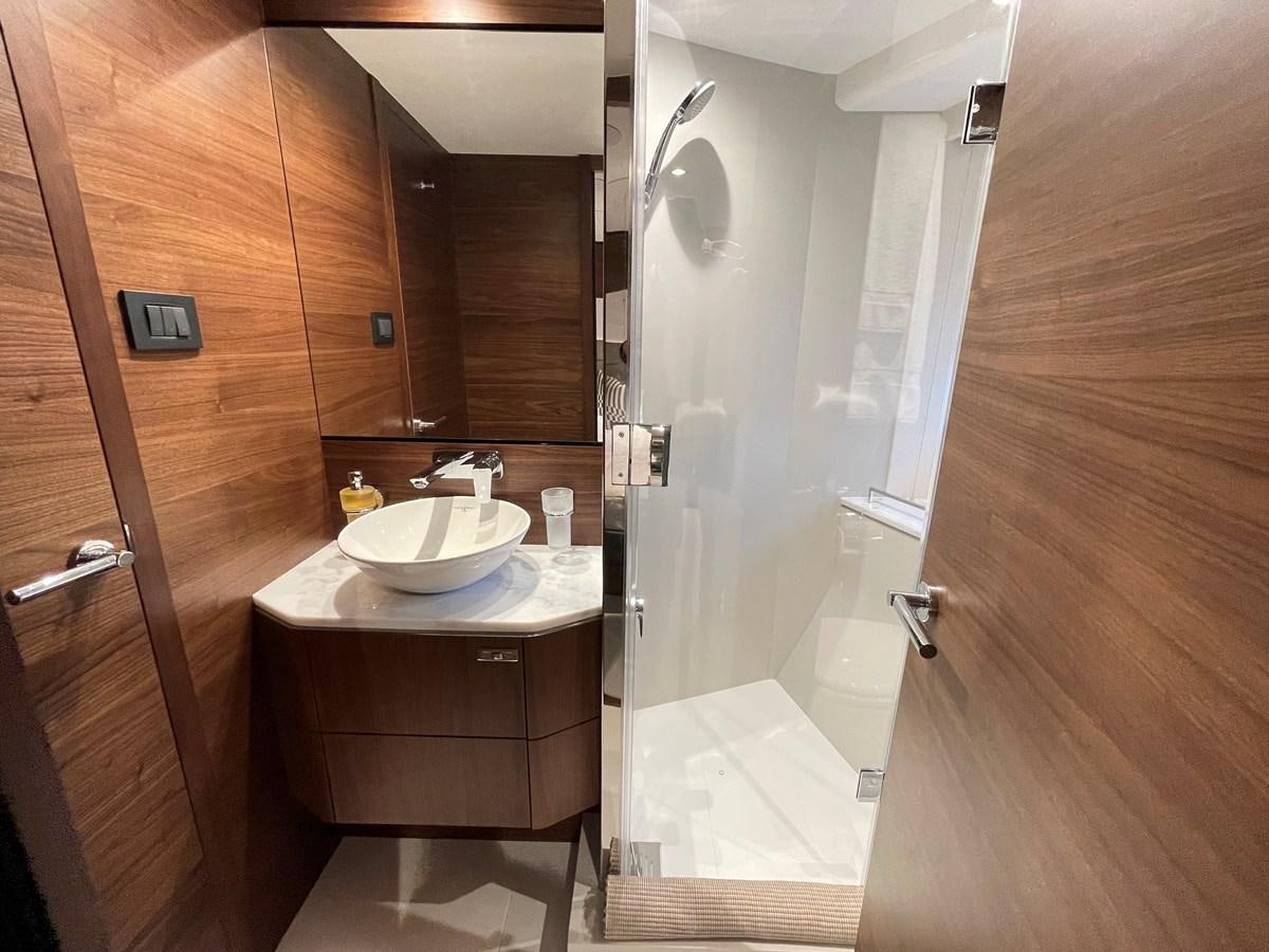 a bathroom with a sink and a shower aboard LESTO Yacht for Sale