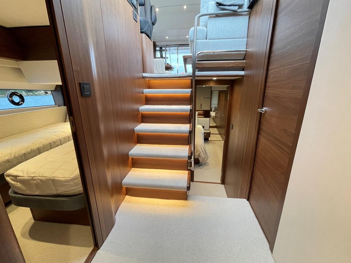 a room with a bed and a door aboard LESTO Yacht for Sale