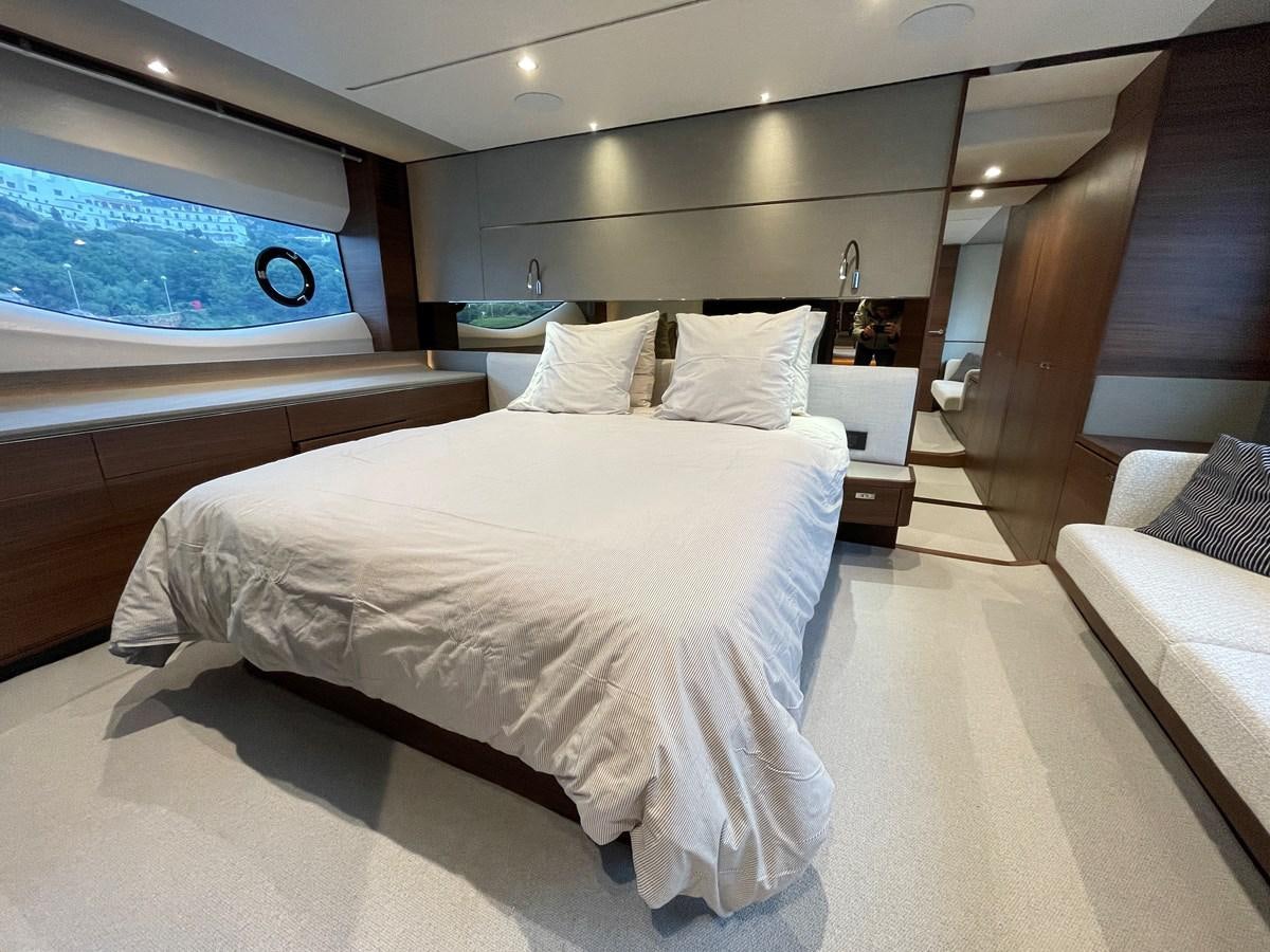 a room with a bed and a window aboard LESTO Yacht for Sale