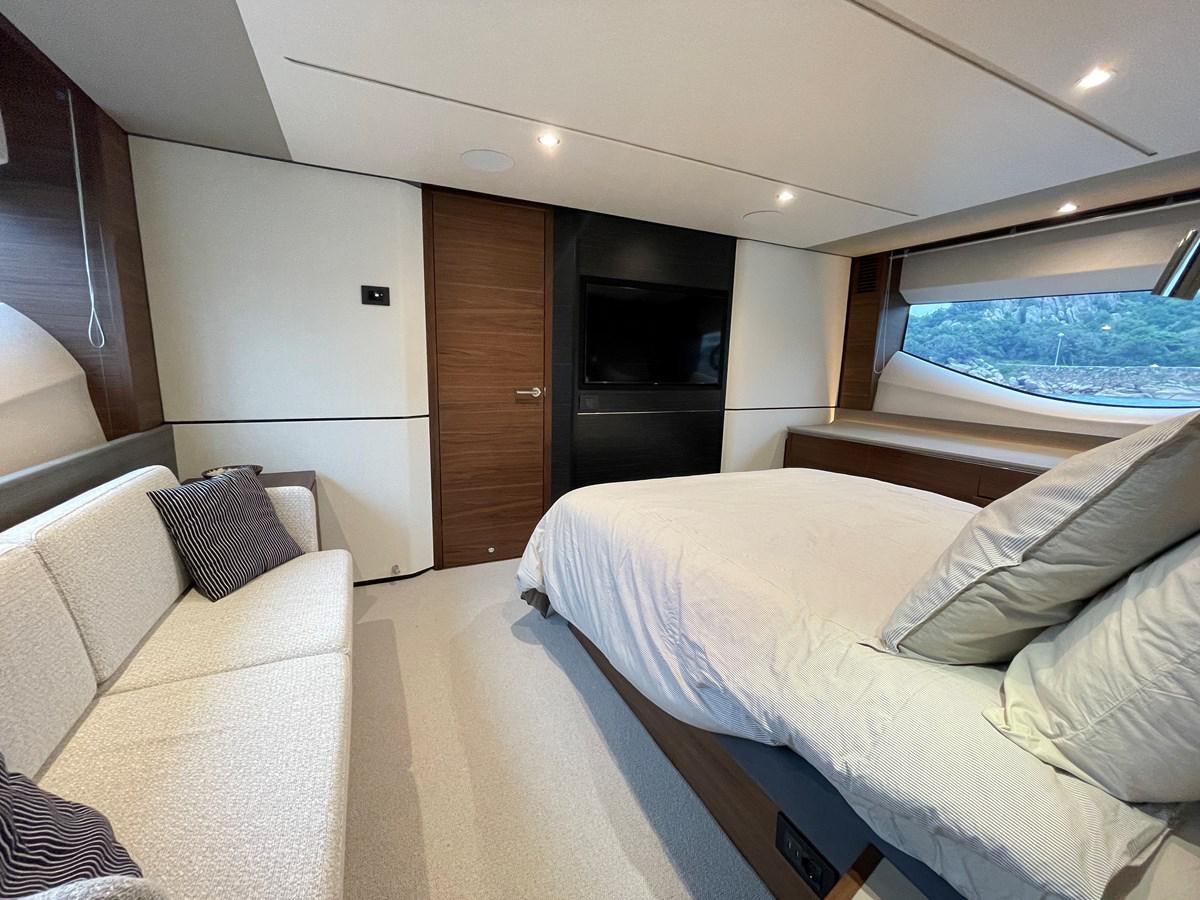 a room with a bed and a window aboard LESTO Yacht for Sale