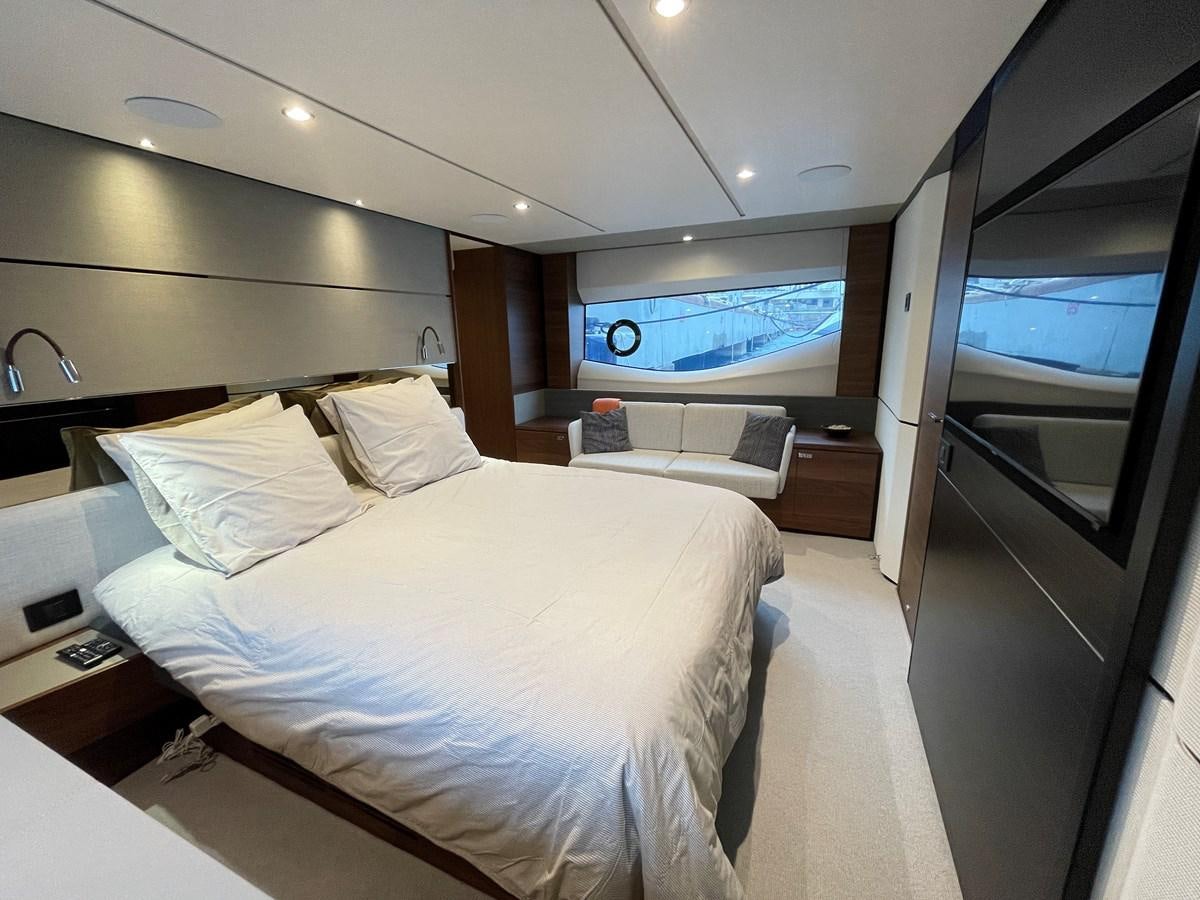 a room with a bed and a window aboard LESTO Yacht for Sale
