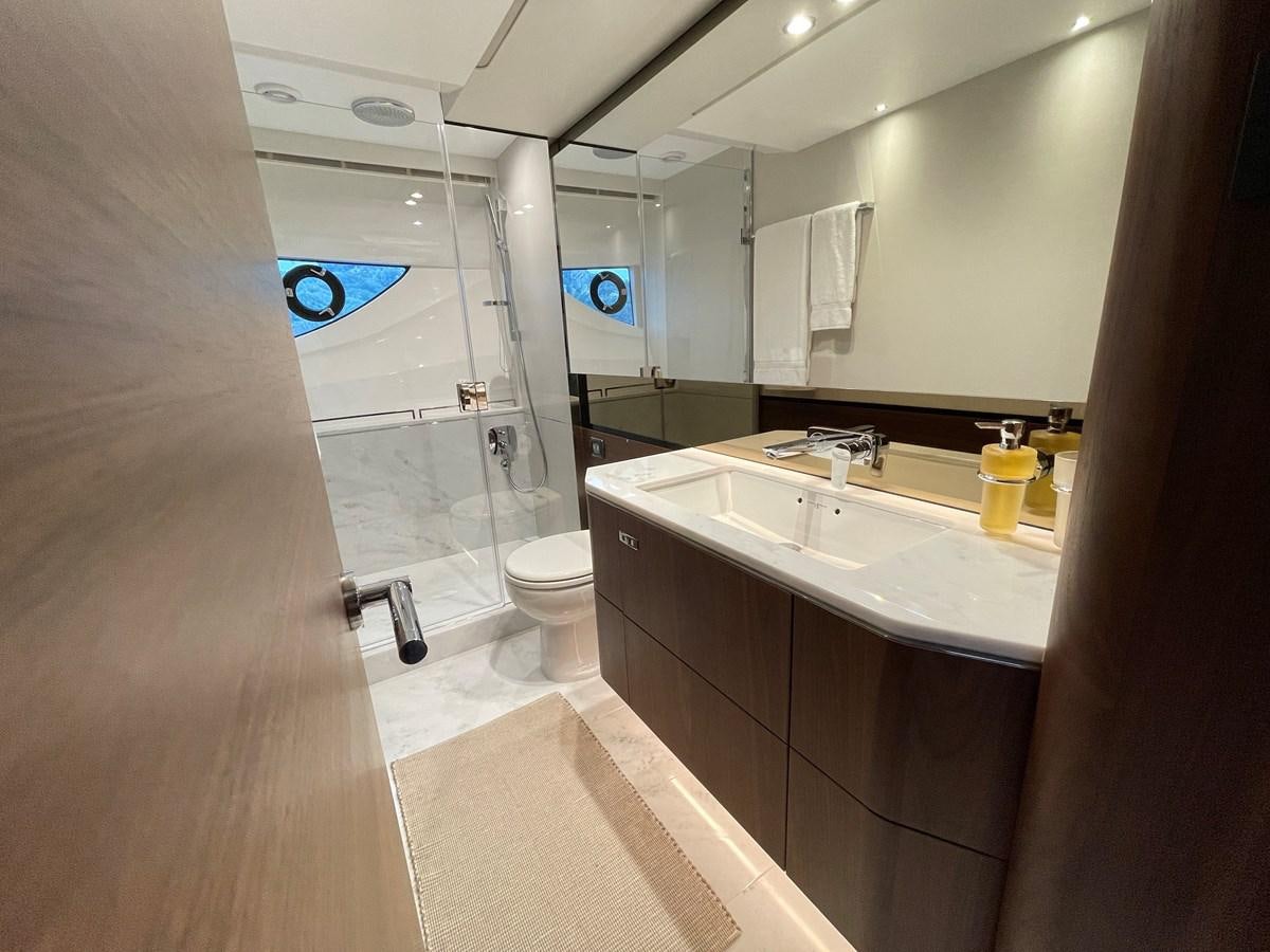 a bathroom with a glass shower aboard LESTO Yacht for Sale