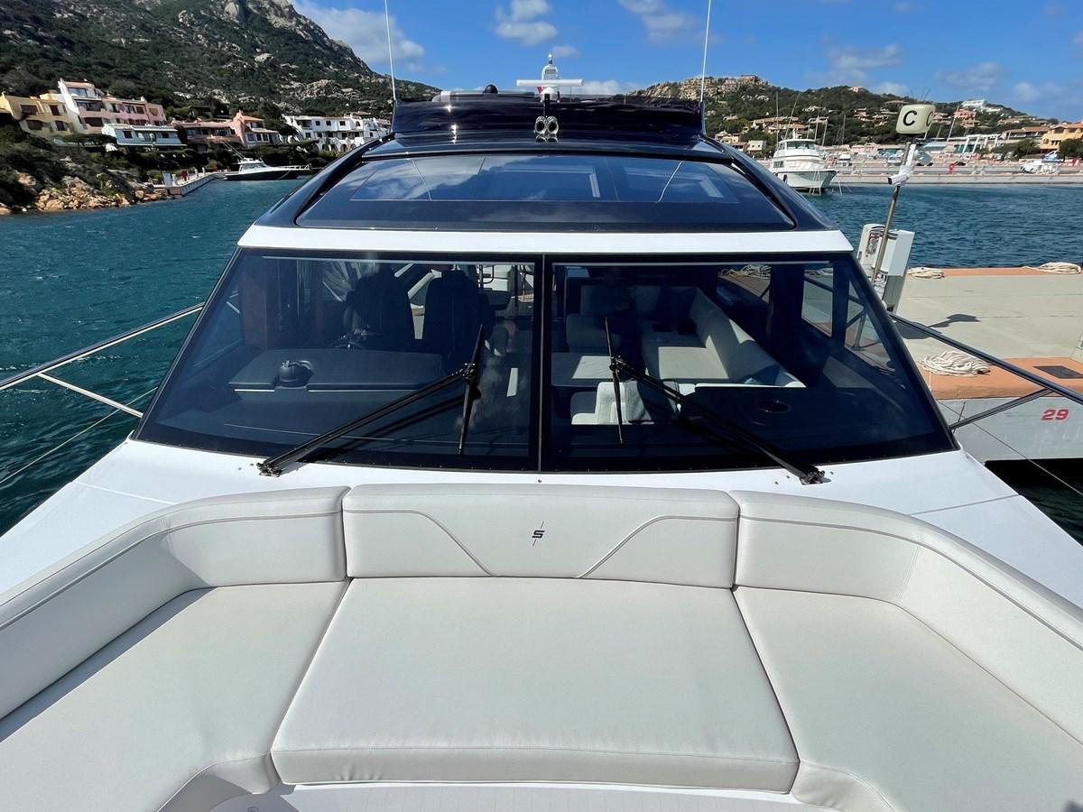 a white car on a road aboard LESTO Yacht for Sale