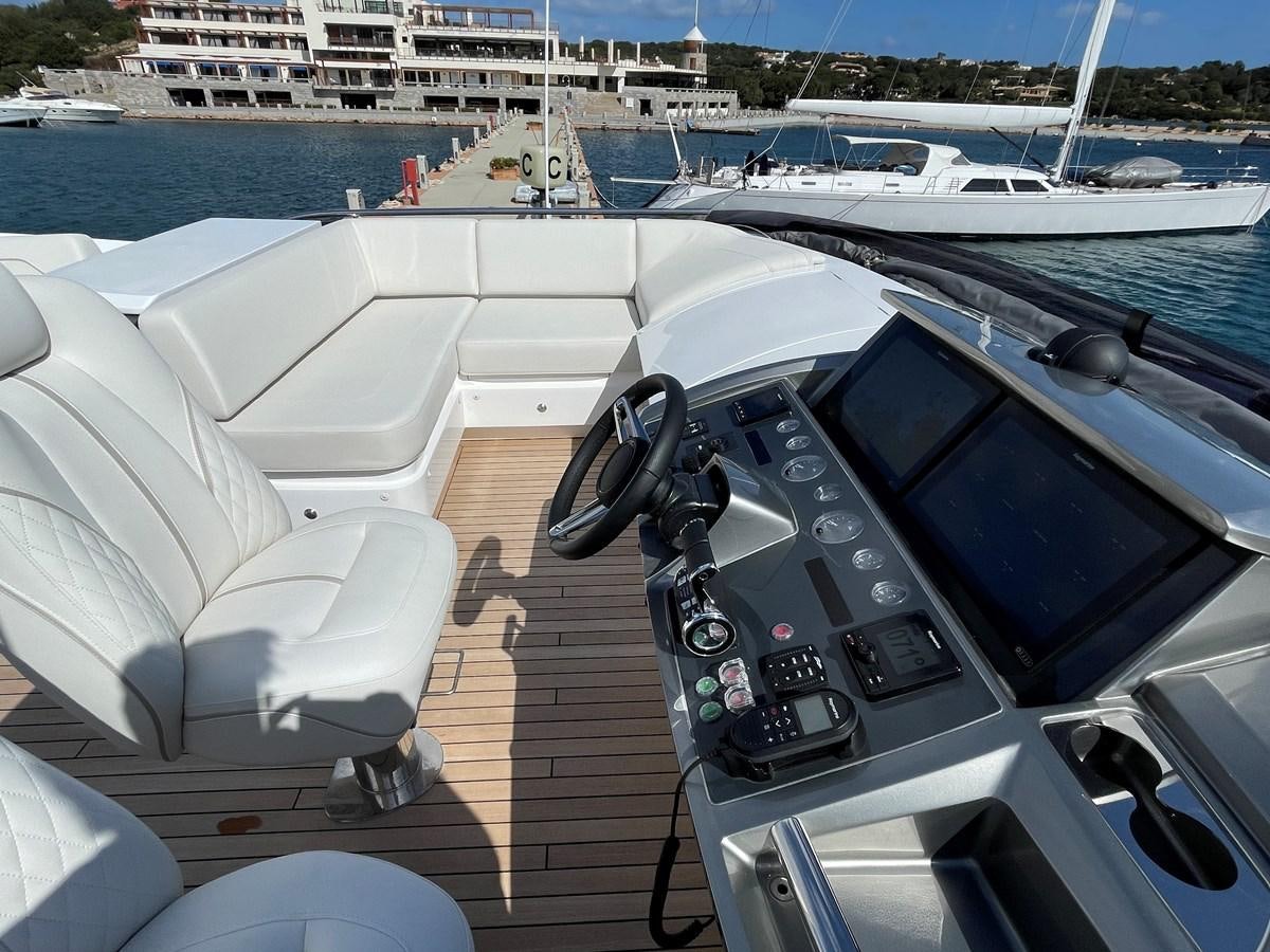 a car on a deck aboard LESTO Yacht for Sale