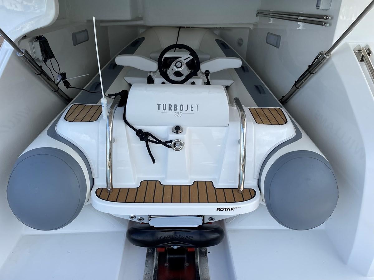 a white machine with a black handle aboard LESTO Yacht for Sale