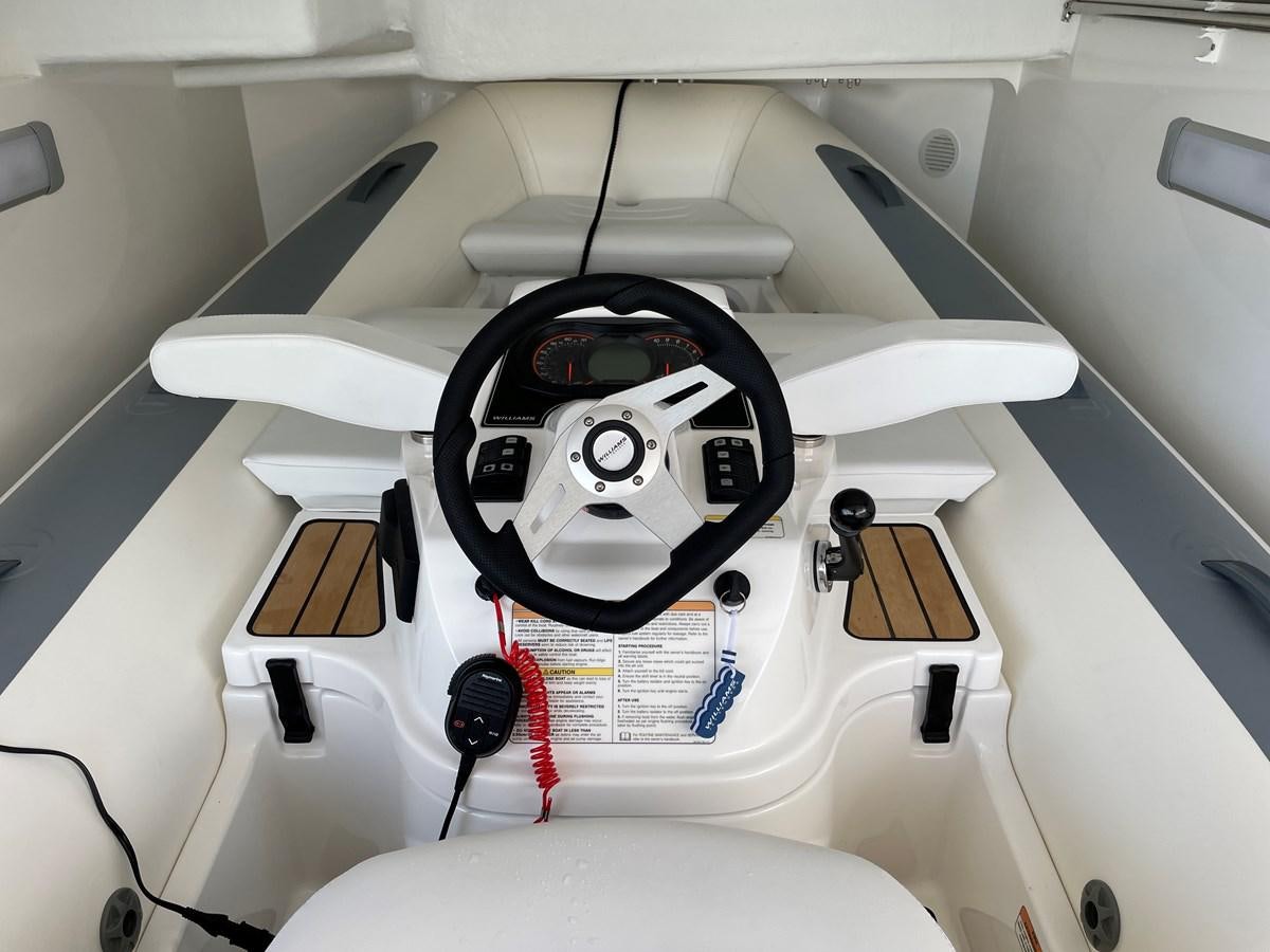 a white and black object with a round object in the center aboard LESTO Yacht for Sale
