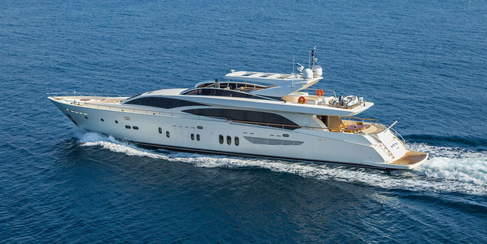 a white yacht on the water aboard WATER TOY III Yacht for Sale