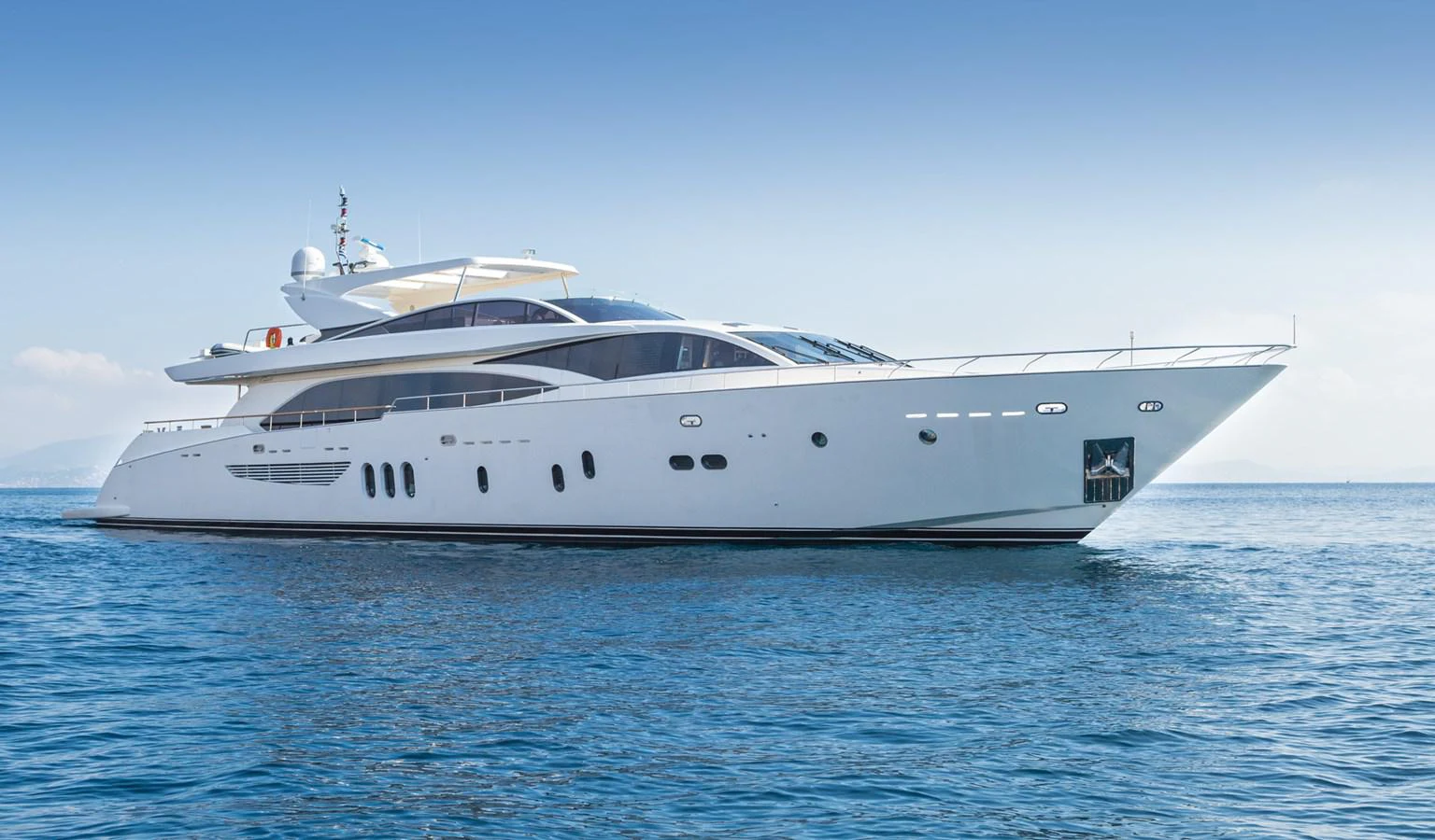 a white yacht in the water aboard WATER TOY III Yacht for Sale