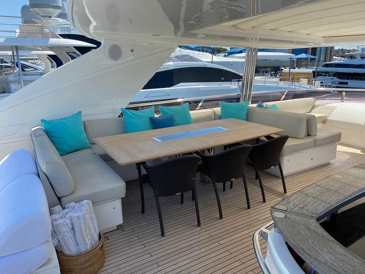 a boat with tables and chairs aboard EXPERIENCE Yacht for Sale