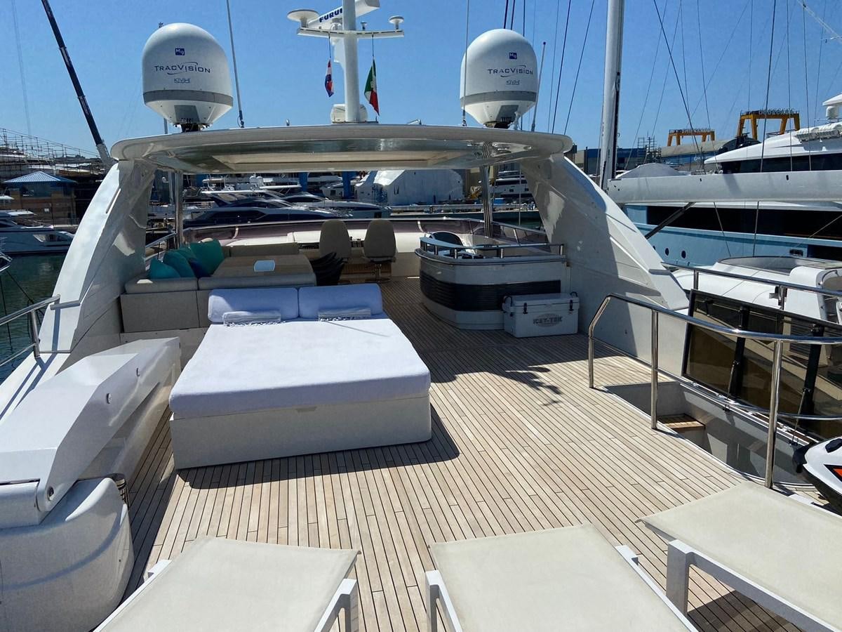 a deck with a boat and a satellite dish on it aboard EXPERIENCE Yacht for Sale