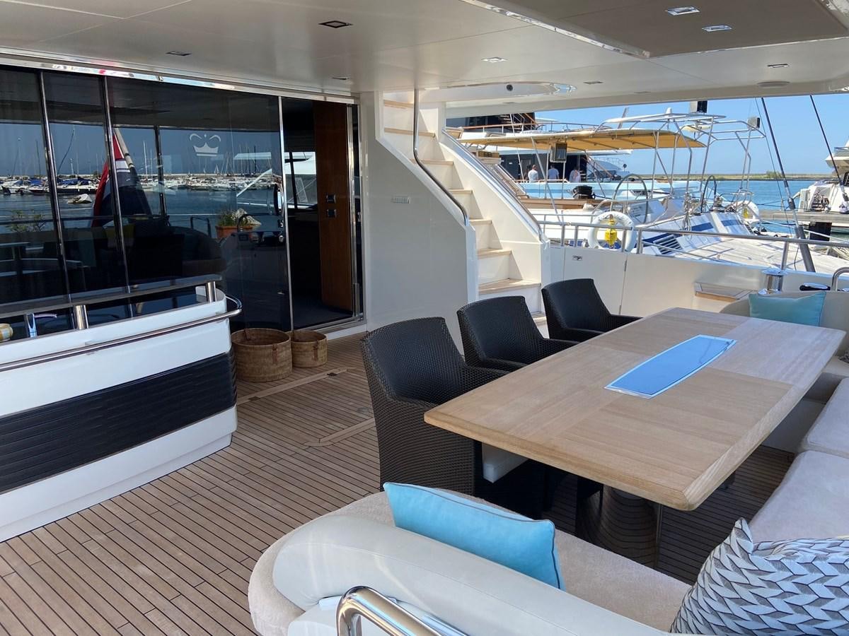 a room with a table and chairs aboard EXPERIENCE Yacht for Sale