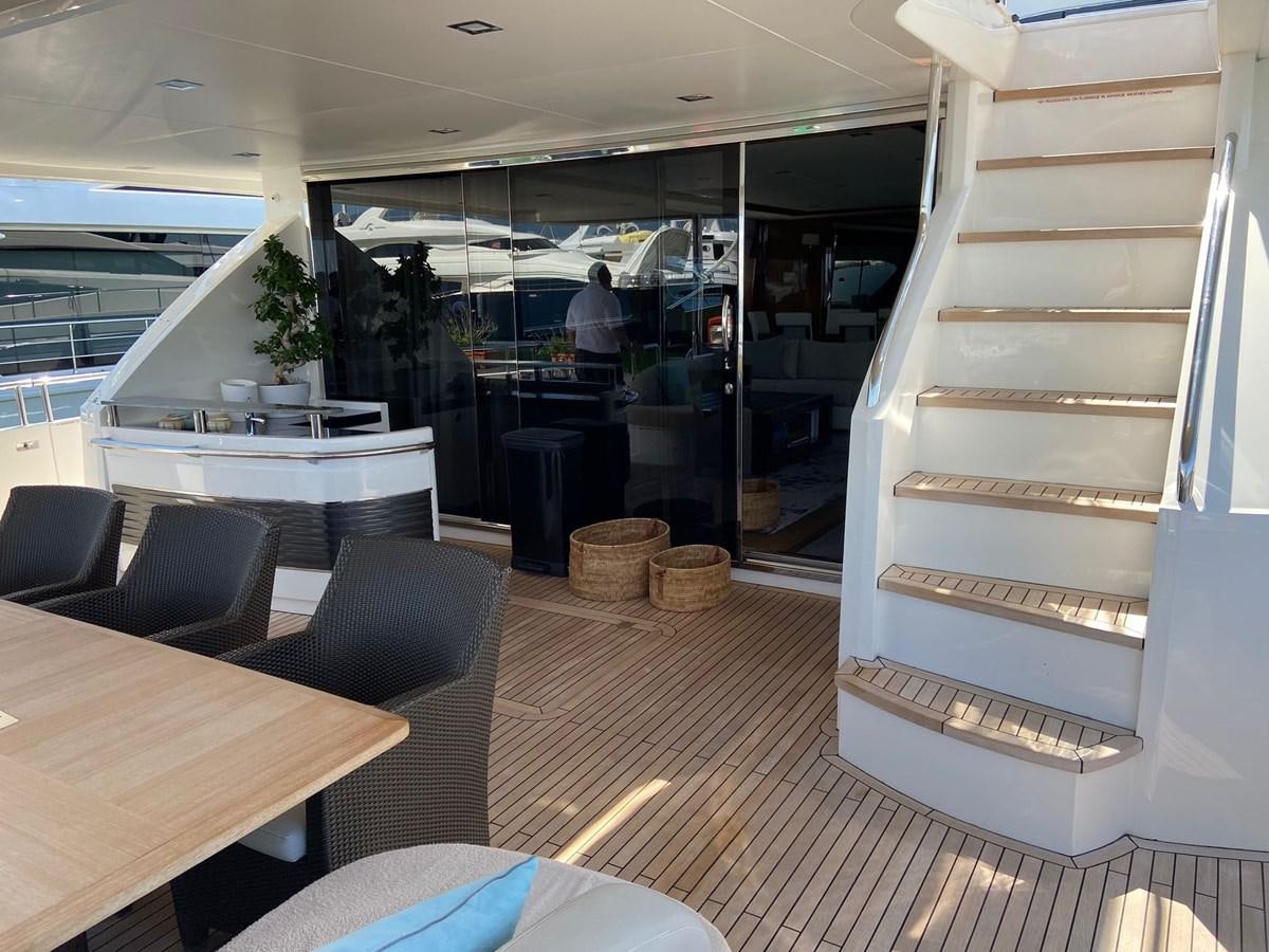 a room with a table and chairs aboard EXPERIENCE Yacht for Sale