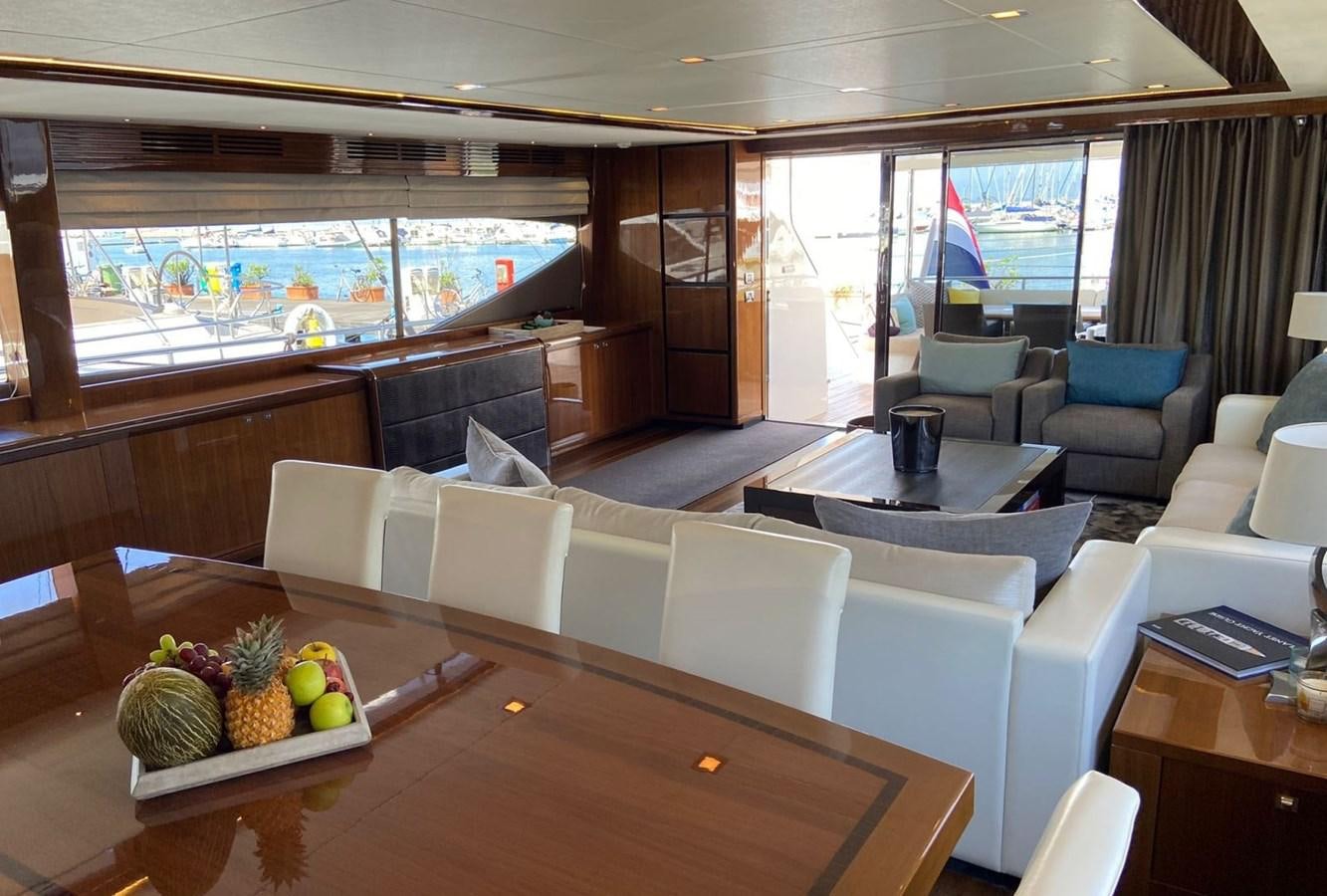 a room with a table chairs and a large window aboard EXPERIENCE Yacht for Sale
