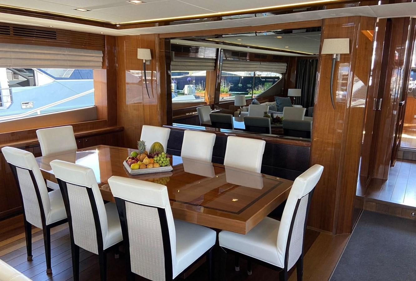 a dining room with a table and chairs aboard EXPERIENCE Yacht for Sale