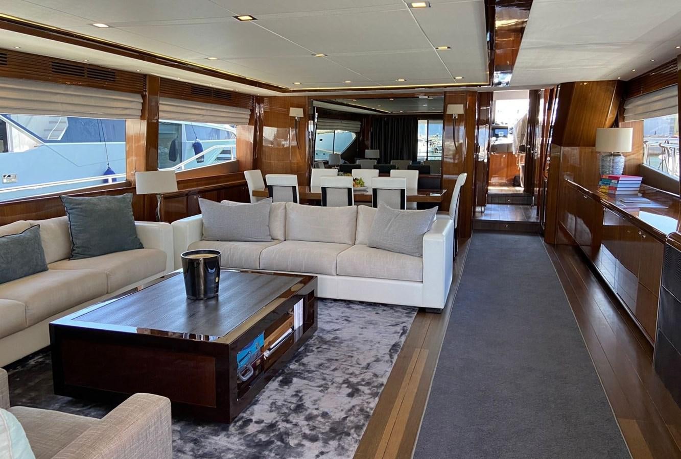 a living room with a couch and a coffee table aboard EXPERIENCE Yacht for Sale