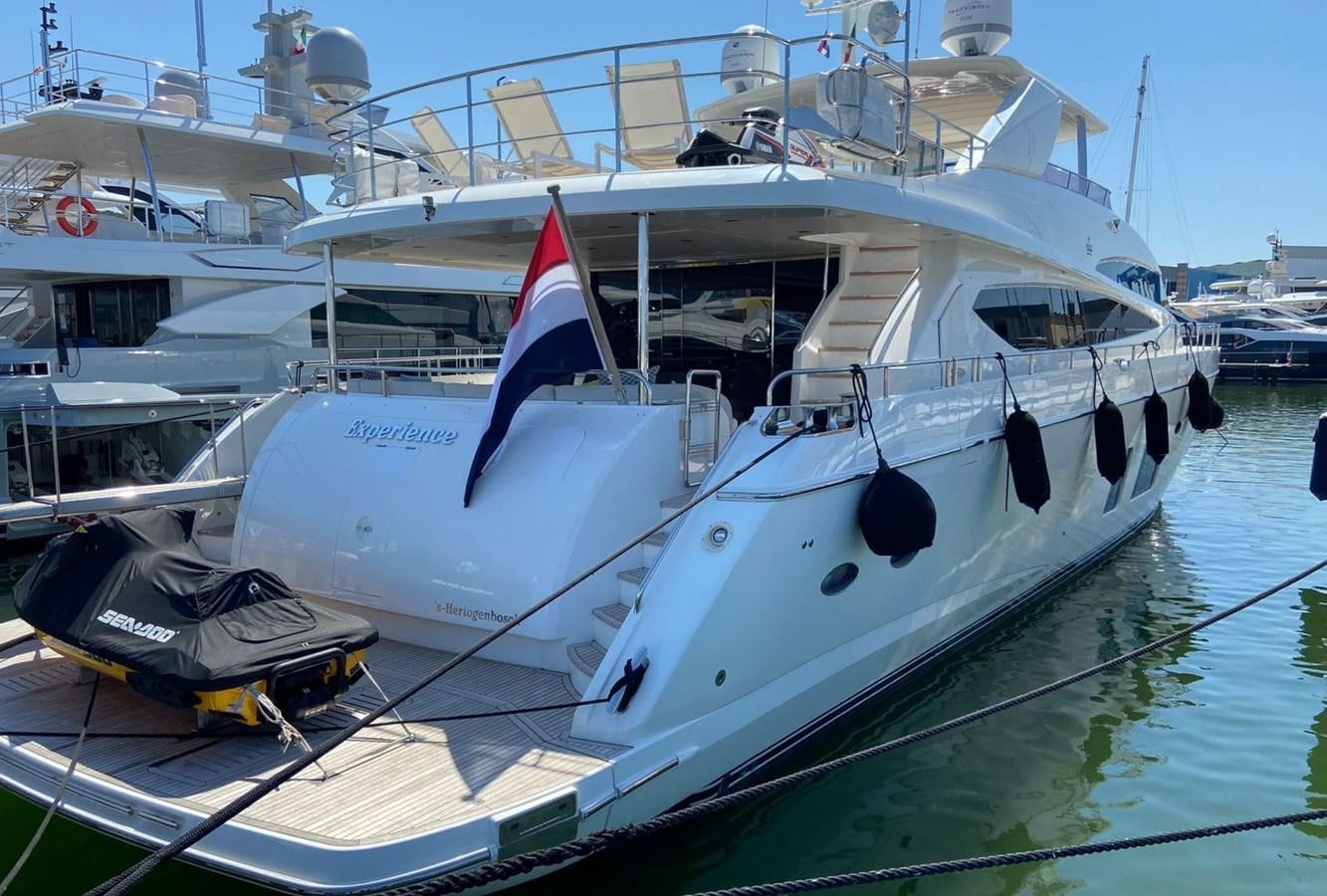 a boat docked at a pier aboard EXPERIENCE Yacht for Sale