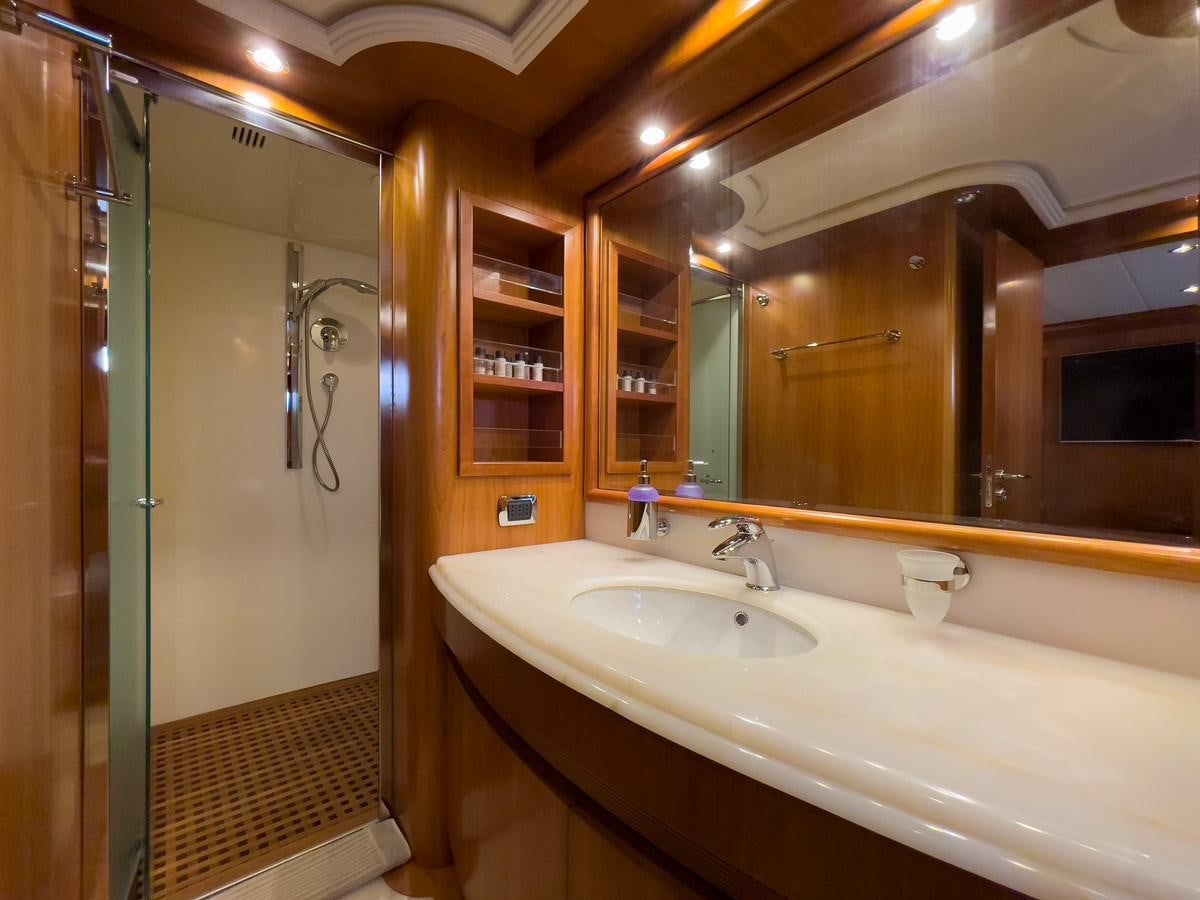a bathroom with a large mirror aboard SALTY Yacht for Sale