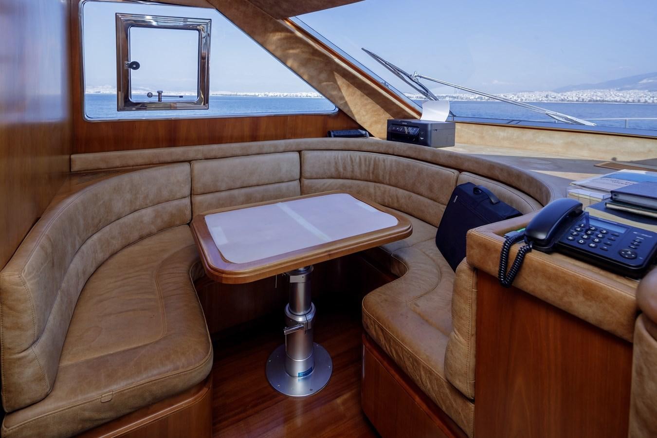 a table and a chair on a boat aboard SALTY Yacht for Sale