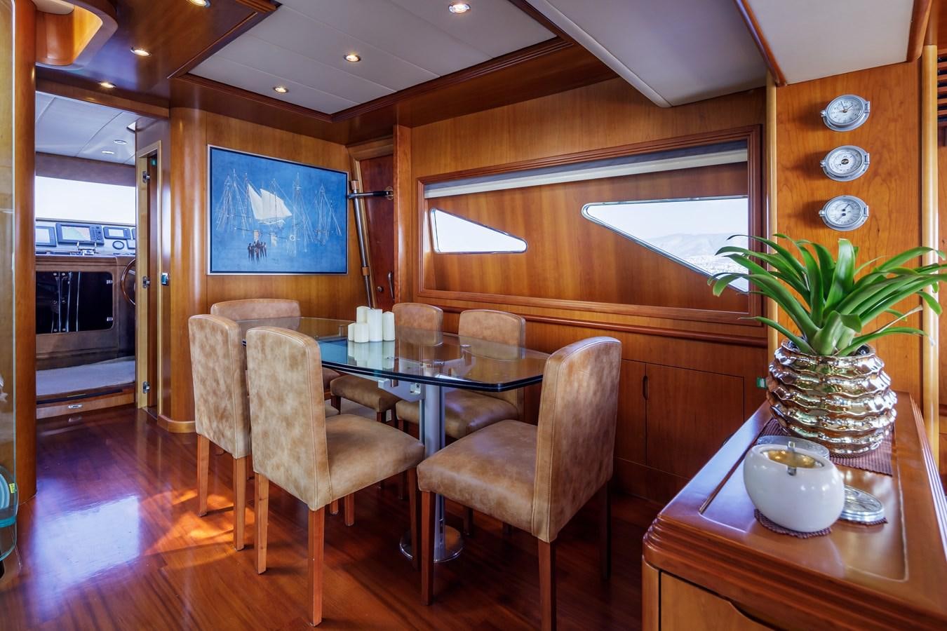a dining room with a table and chairs aboard SALTY Yacht for Sale