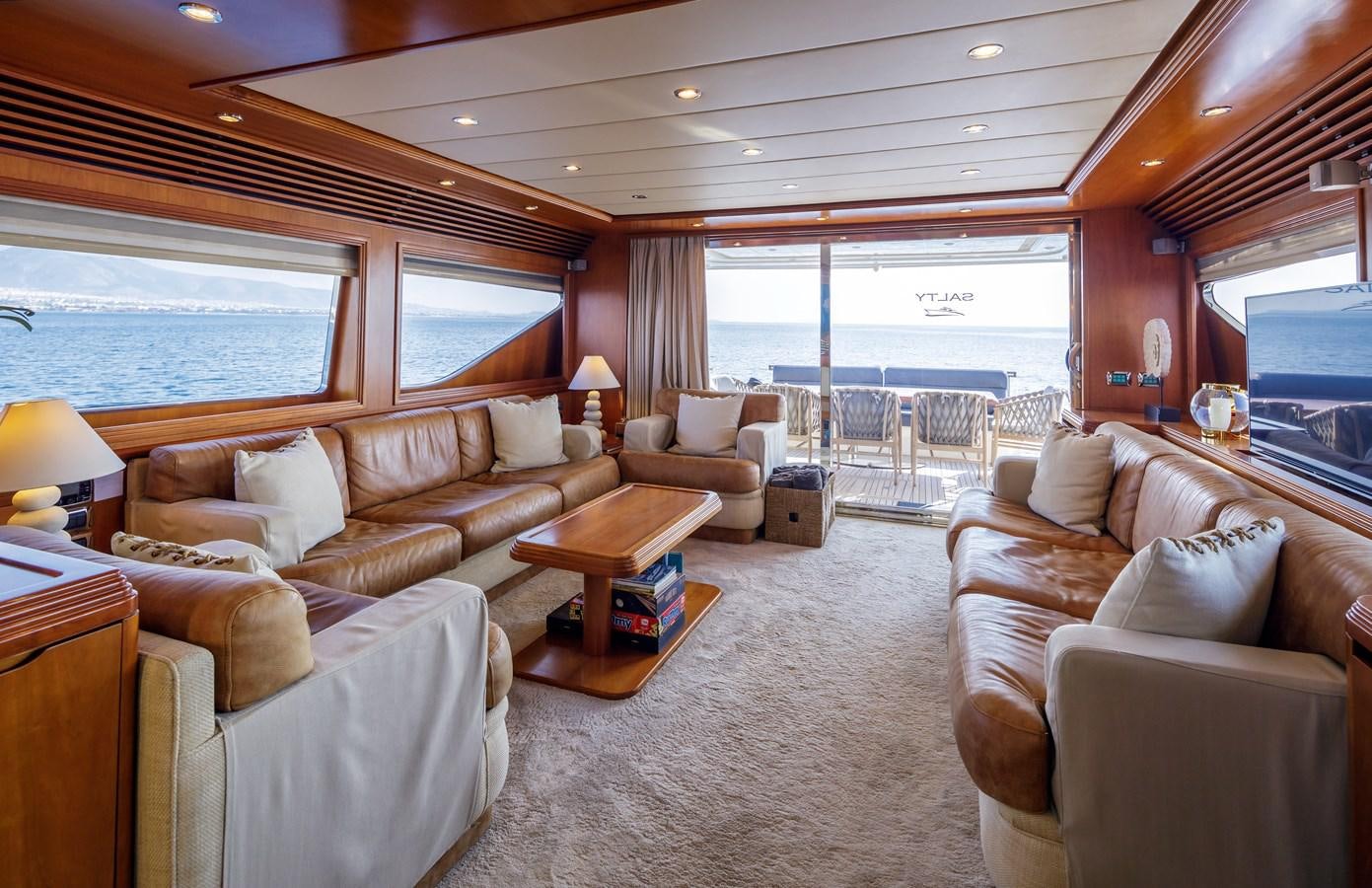 a living room with a large window aboard SALTY Yacht for Sale