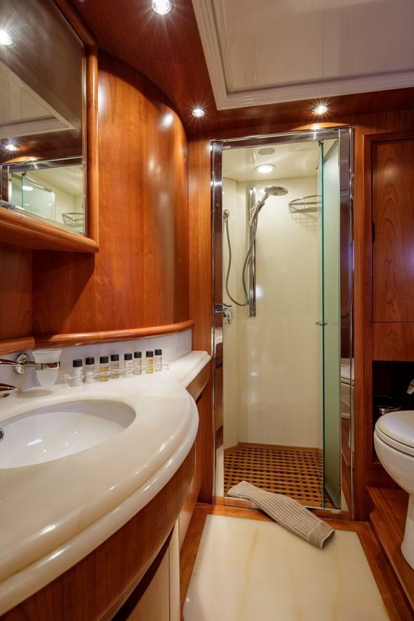 a bathroom with a large mirror aboard SALTY Yacht for Sale