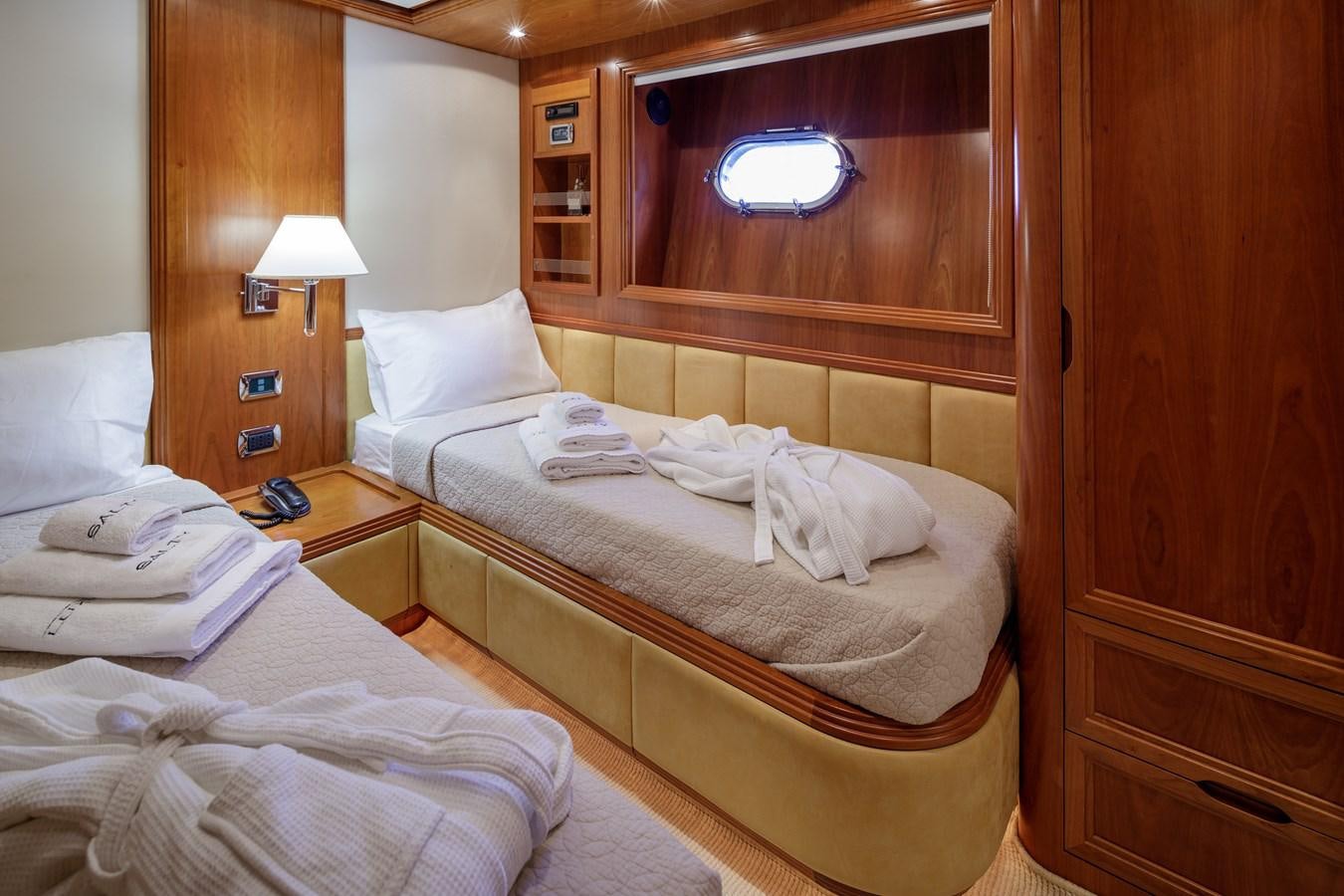 a room with a couple of beds aboard SALTY Yacht for Sale