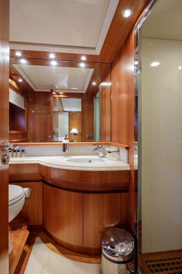 a bathroom with a sink and a mirror aboard SALTY Yacht for Sale
