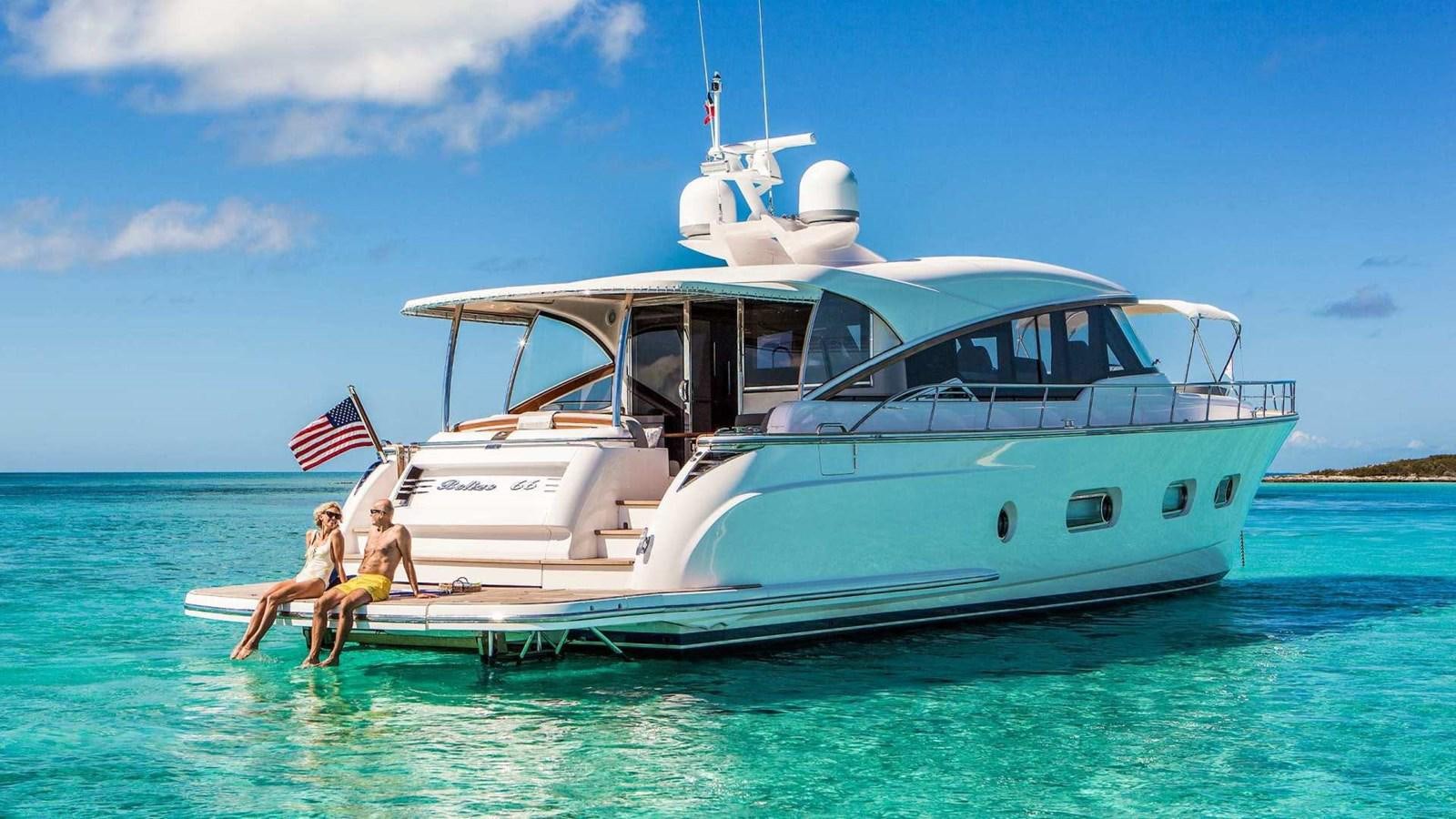 a couple of people sitting on a boat in the water aboard BELIZE 66 SEDAN Yacht for Sale