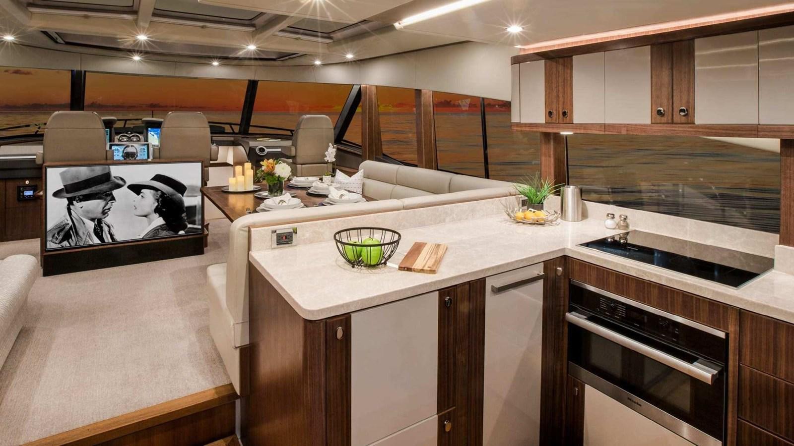 a kitchen with a large island aboard BELIZE 66 SEDAN Yacht for Sale