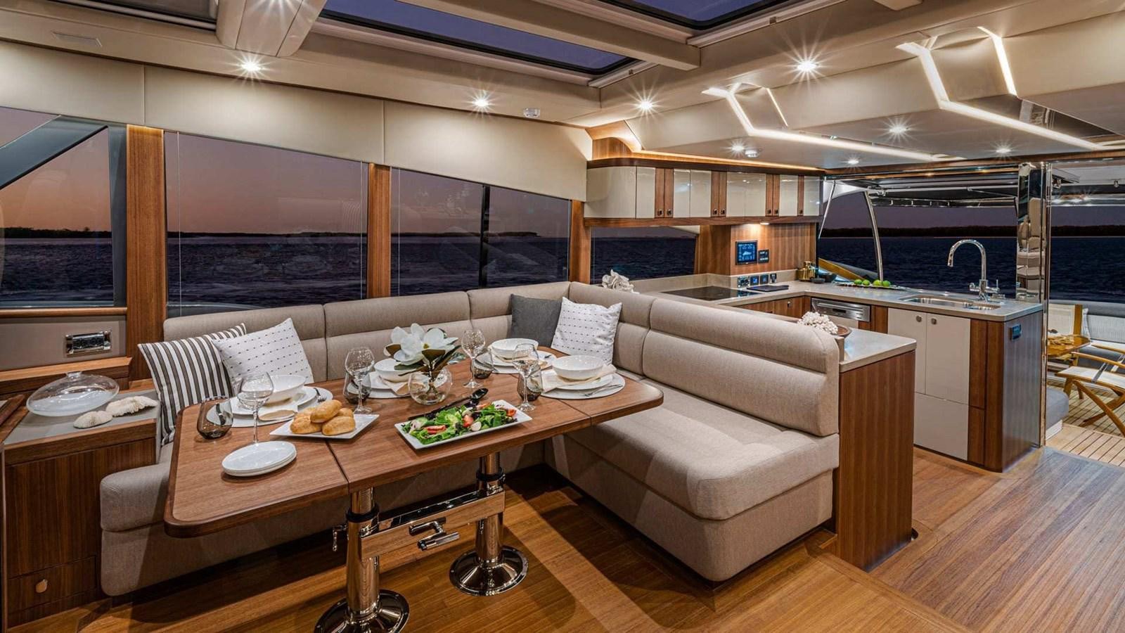 a modern looking living room aboard BELIZE 66 SEDAN Yacht for Sale