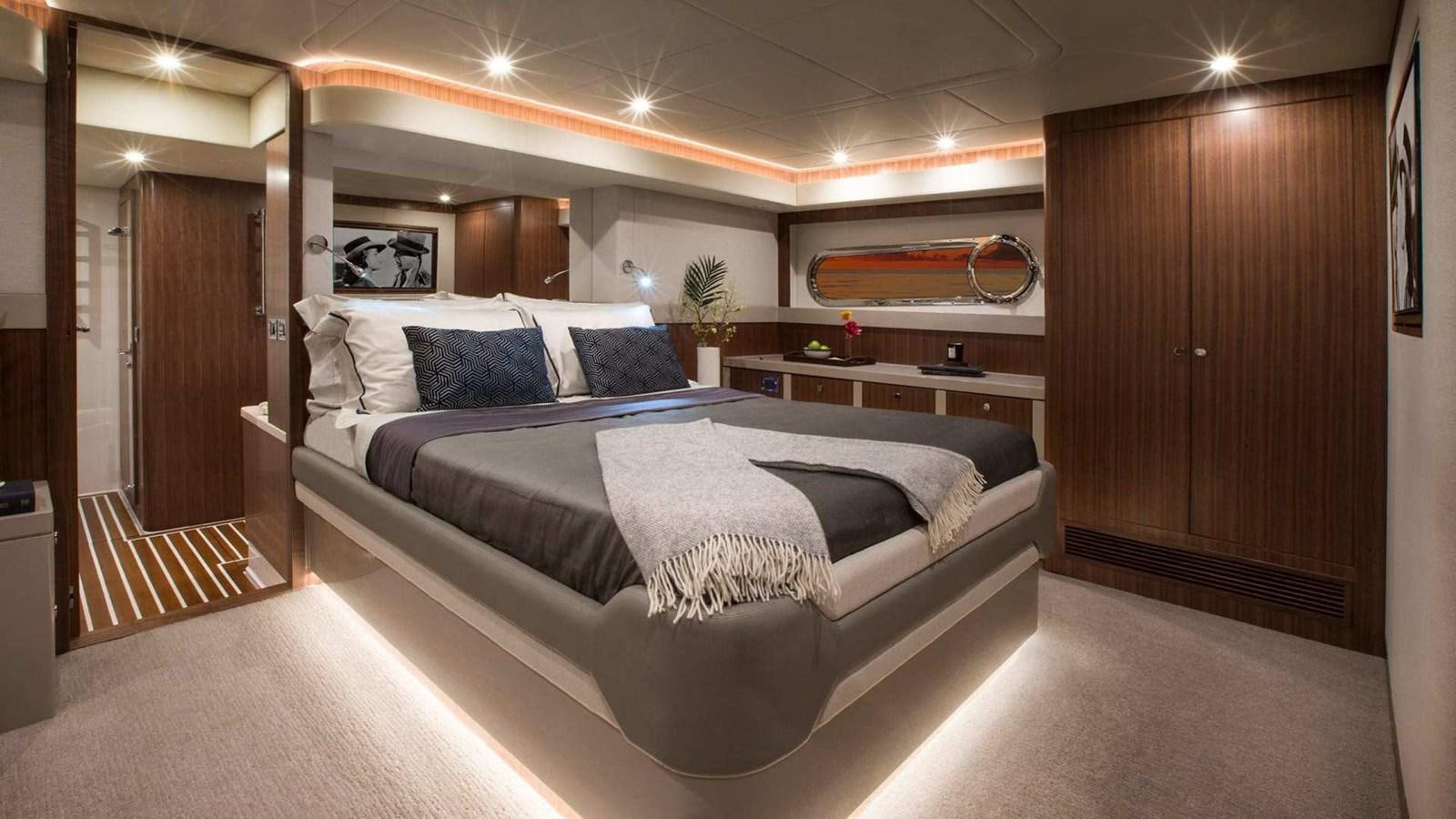 a large bed in a room aboard BELIZE 66 SEDAN Yacht for Sale