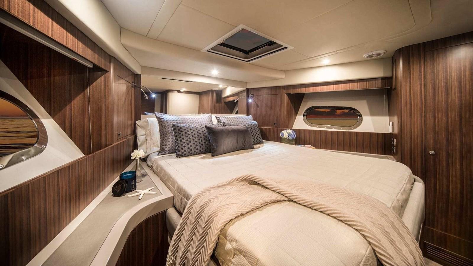 a bed in a room aboard BELIZE 66 SEDAN Yacht for Sale