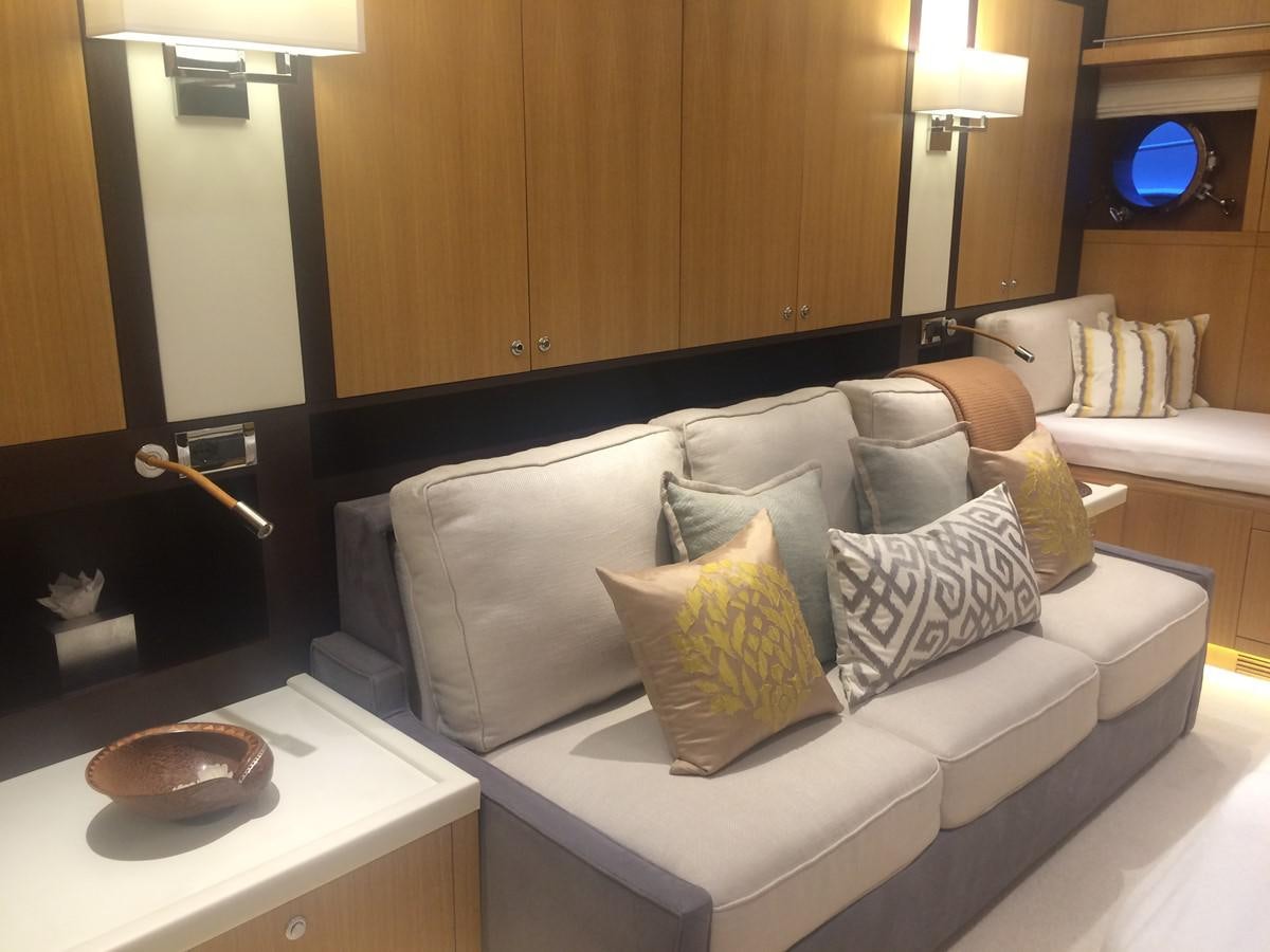 a living room with a couch and a table aboard THE BIG BLUE Yacht for Sale