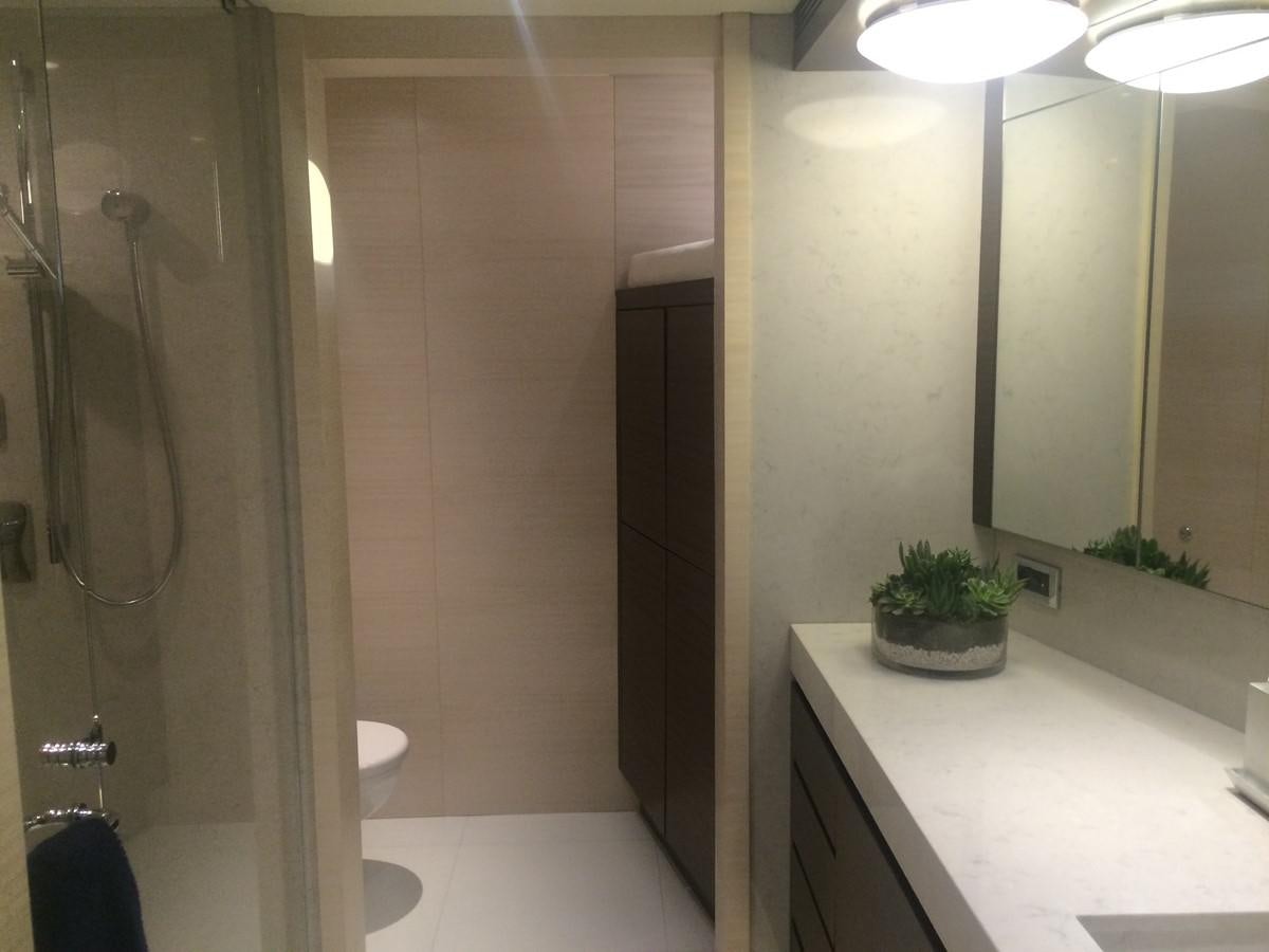 a bathroom with a tub sink and toilet aboard THE BIG BLUE Yacht for Sale