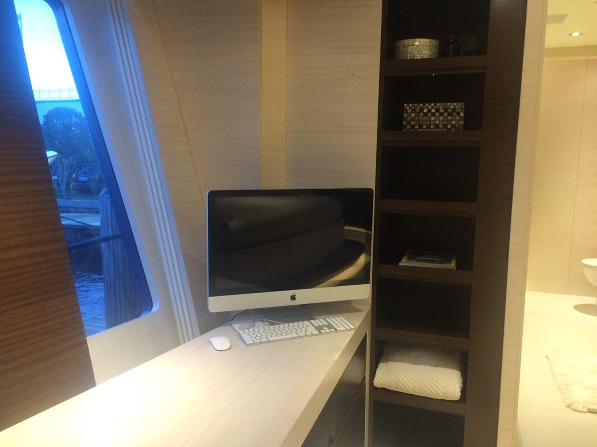 a computer on a desk aboard THE BIG BLUE Yacht for Sale