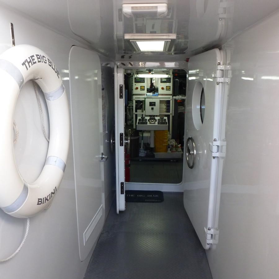 a row of white urinals aboard THE BIG BLUE Yacht for Sale