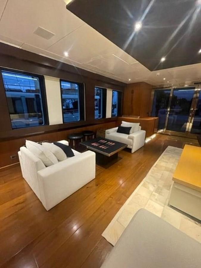 a room with a couch and a table aboard THE BIG BLUE Yacht for Sale