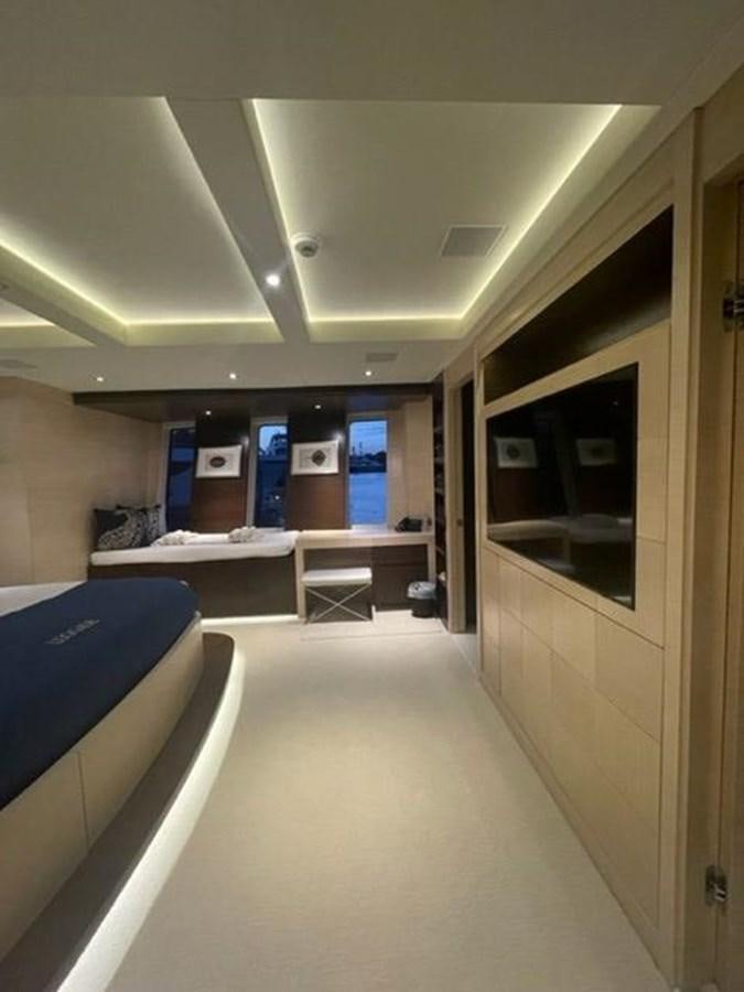 a room with a desk and chairs aboard THE BIG BLUE Yacht for Sale