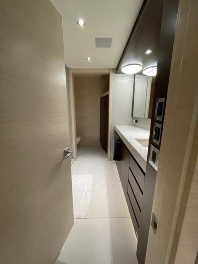 a bathroom with a sink and a mirror aboard THE BIG BLUE Yacht for Sale
